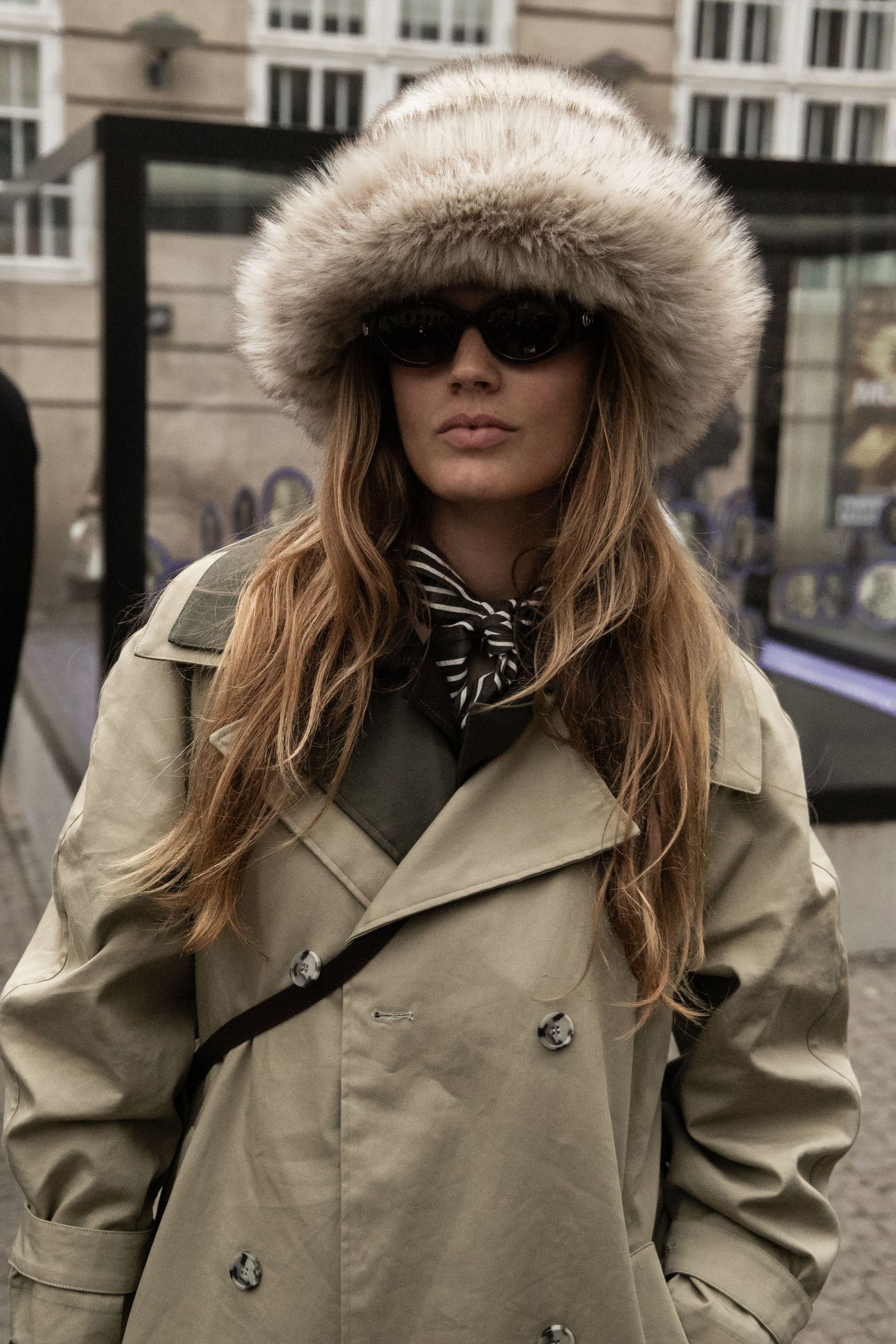 A guest wears a faux fur hat at Copenhagen Fashion Week