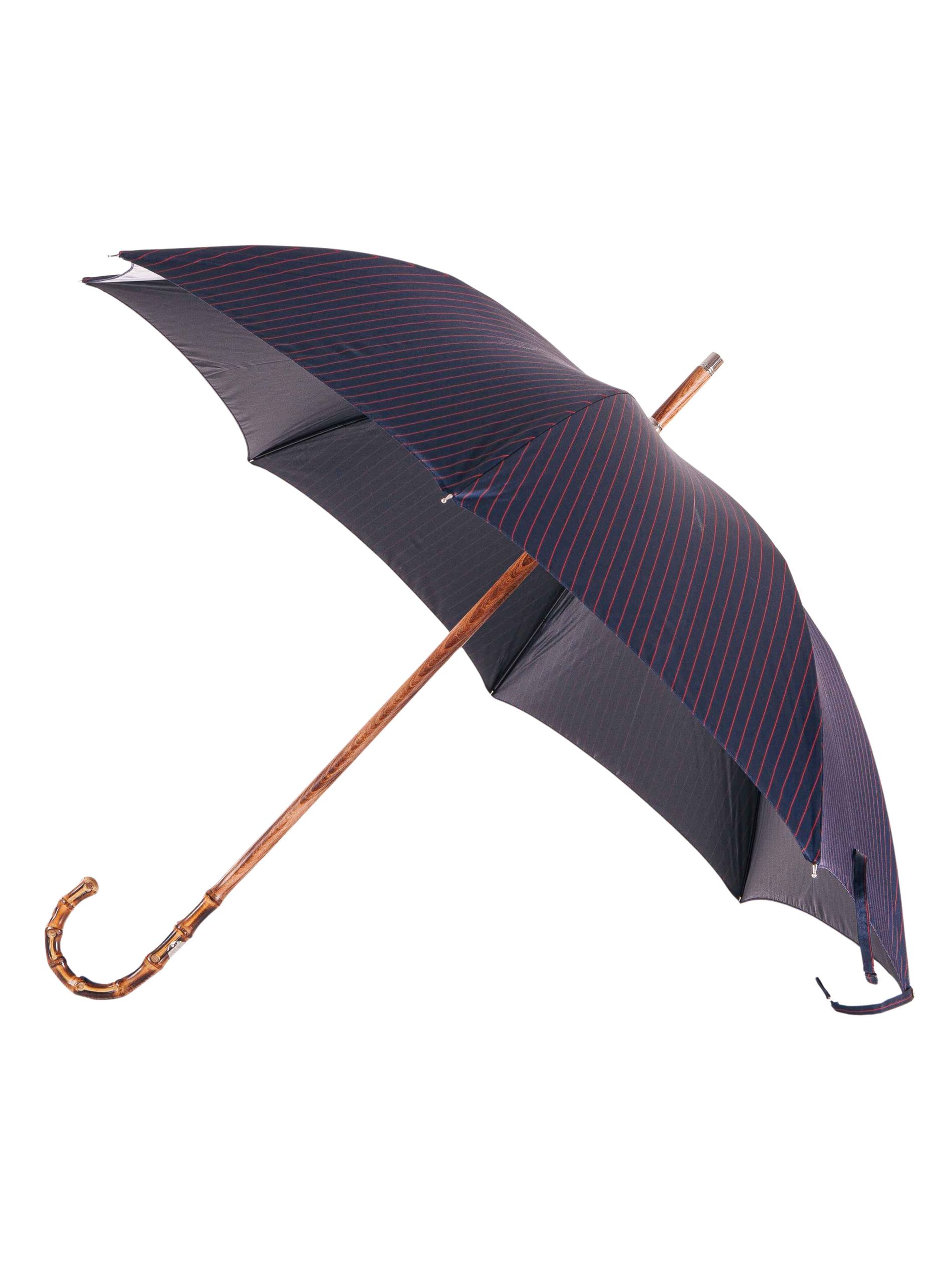 Navy with red stripe umbrella against a white background