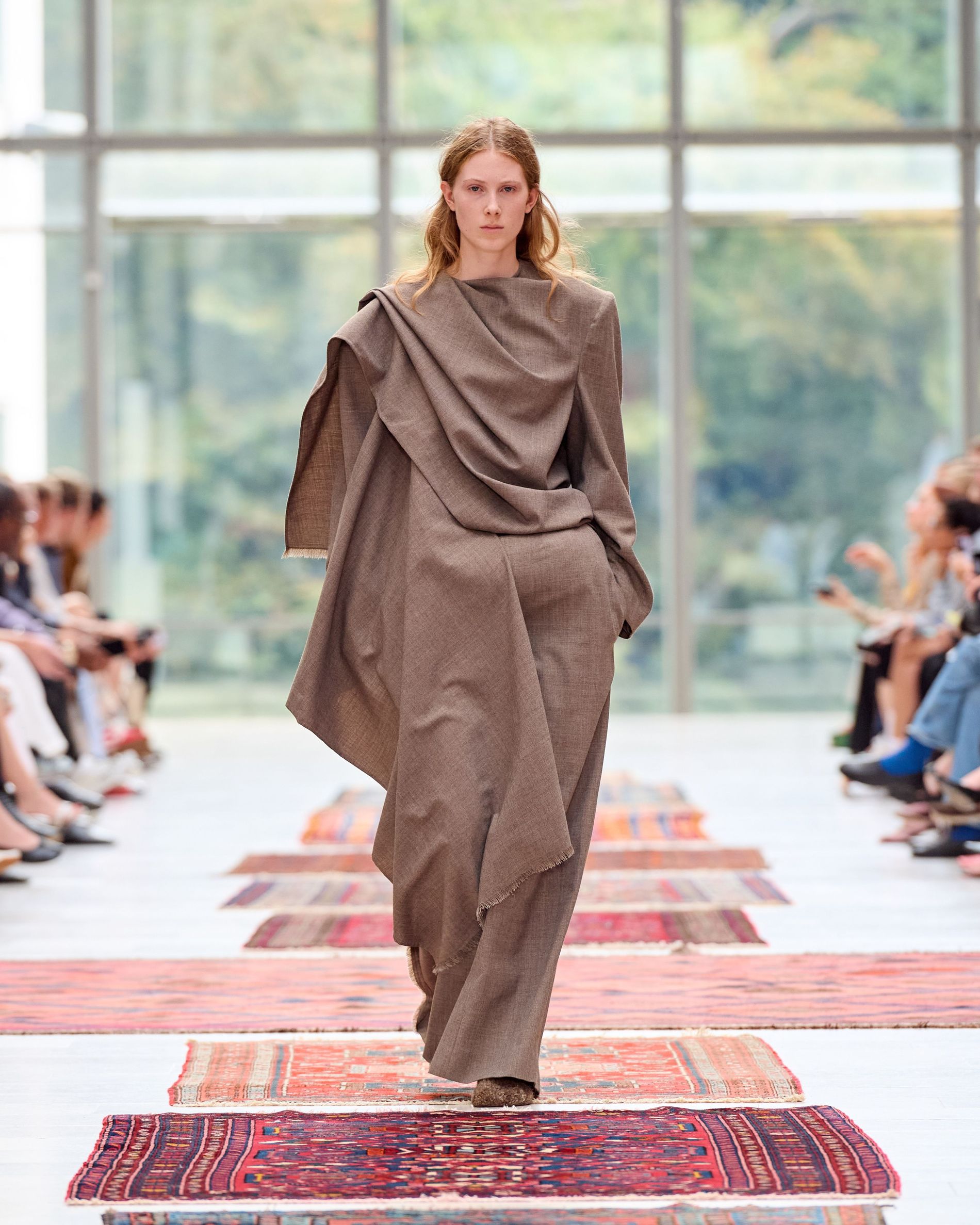 Model is wearing a brown cape set