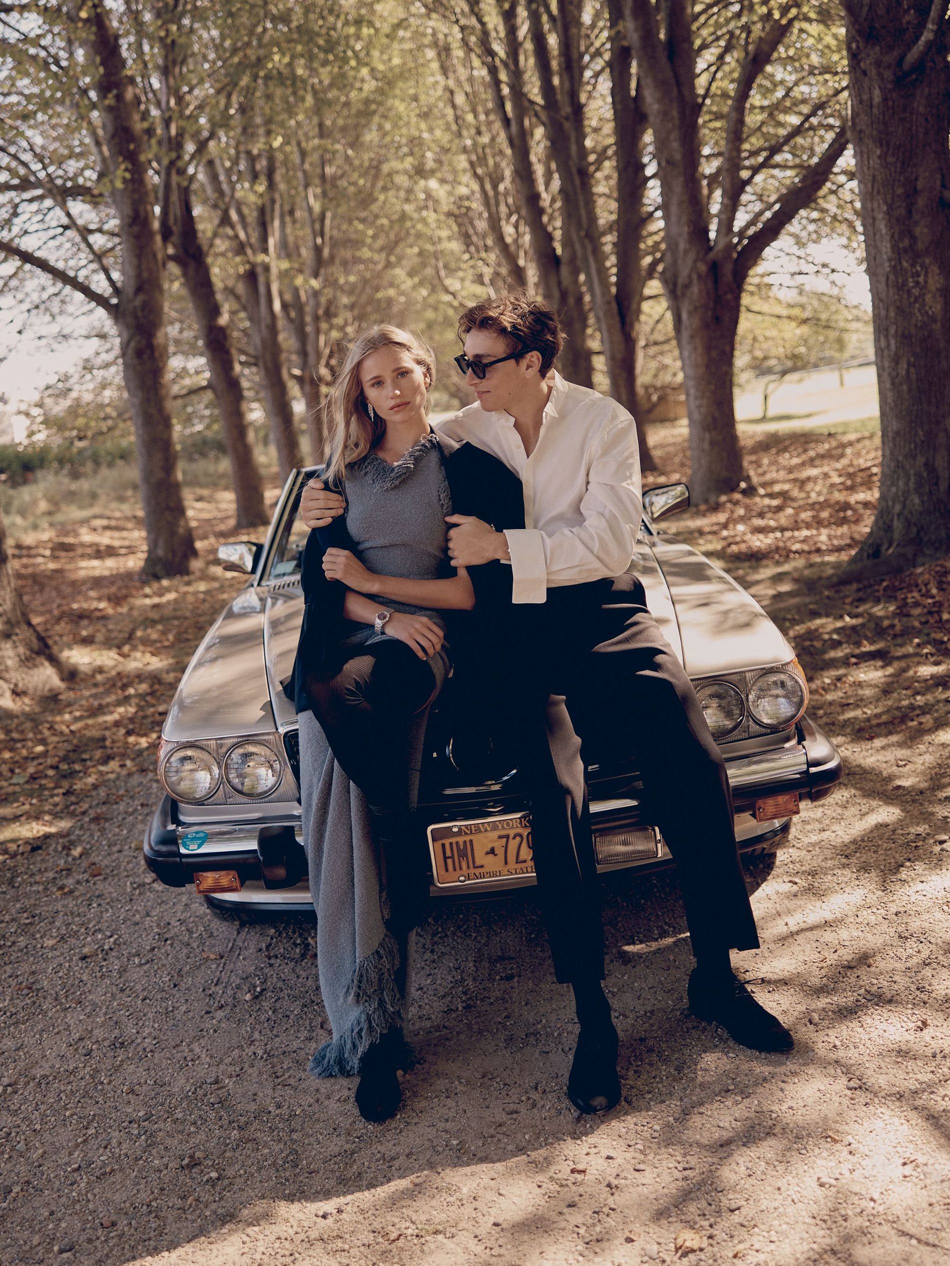 Stylish young couple embracing on a sunny fall day 