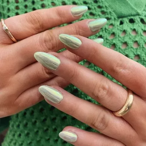 Glazed green nails with a chrome effect will be a nail trend to try in 2025