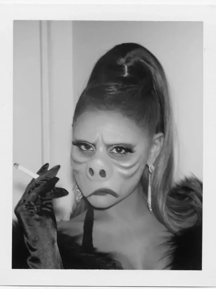 Ariana Grande dressed as pig-like face from “Eye of the Beholder”.