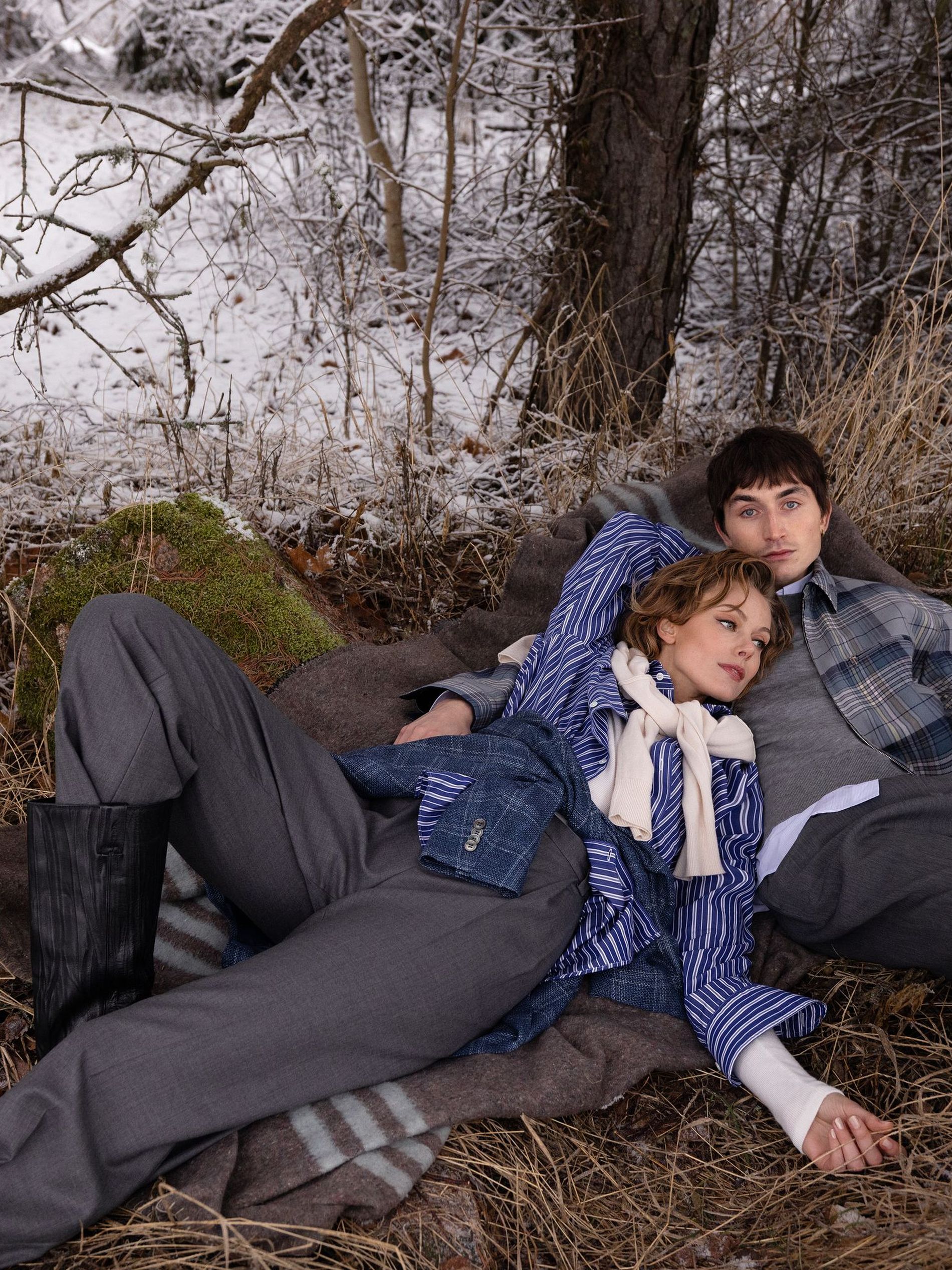 A woman and a man lying on the ground
