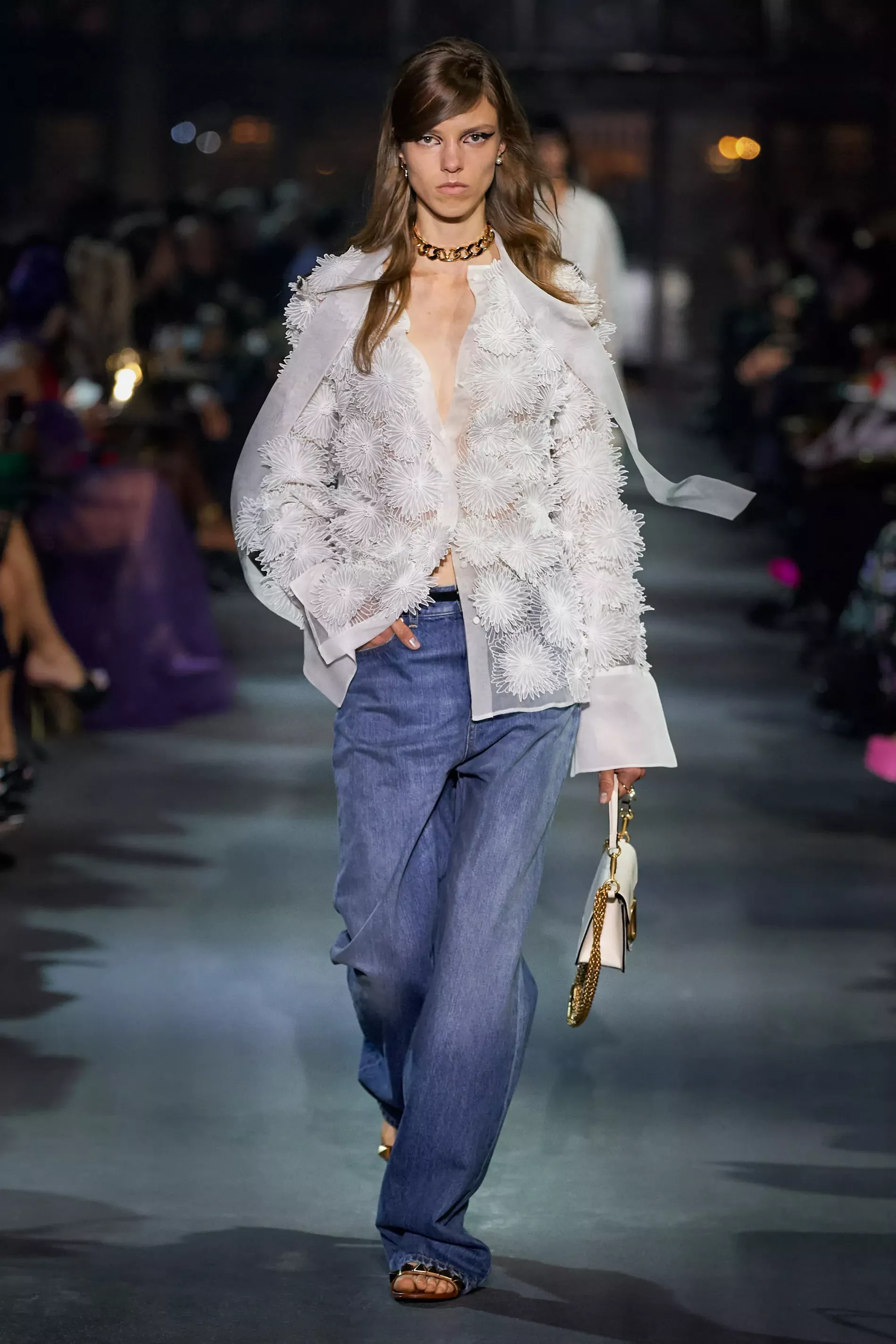 Tulle top paired with denim at Valentino