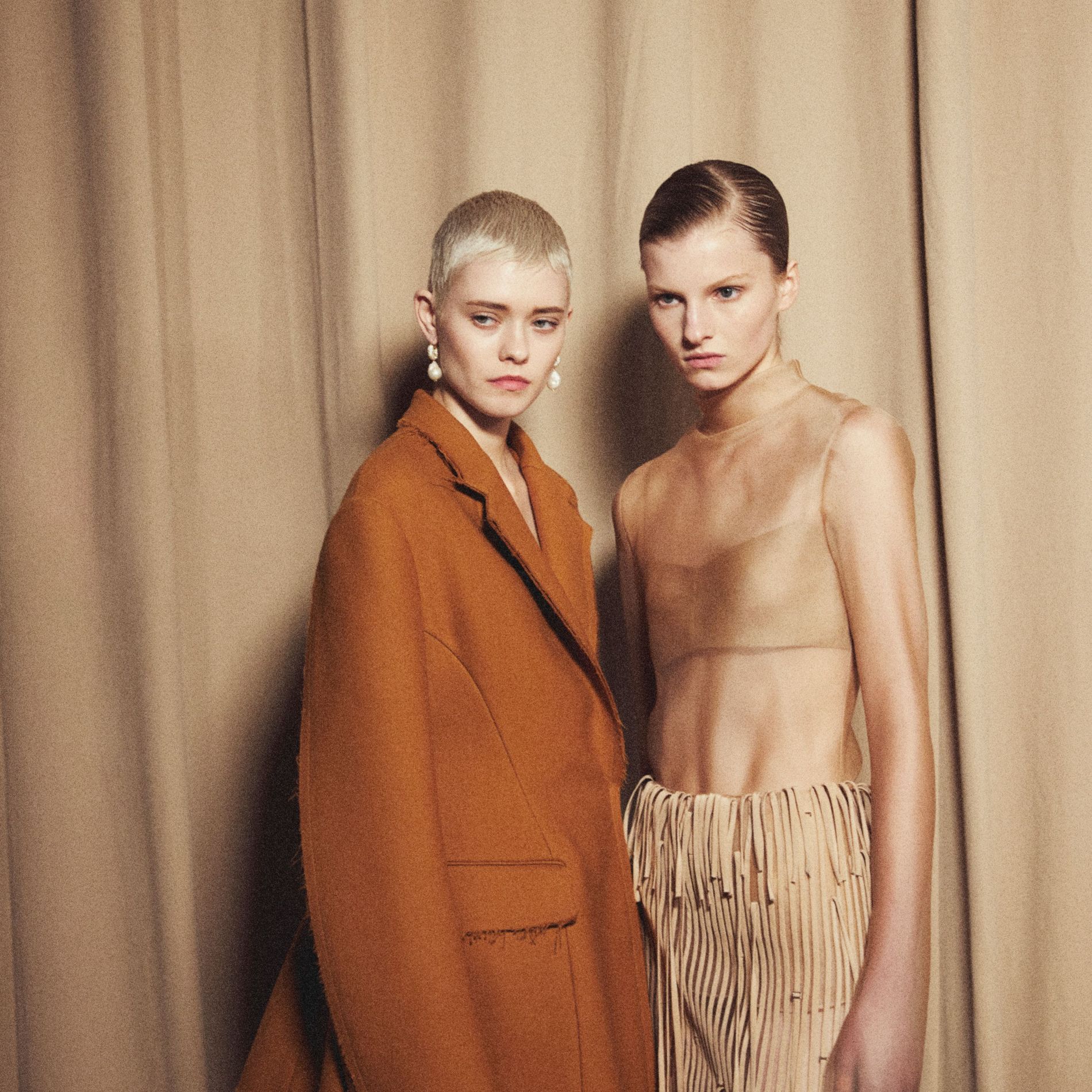 Models pose backstage at Jason Wu's AW23 show wearing Pearl Octopuss.y earrings