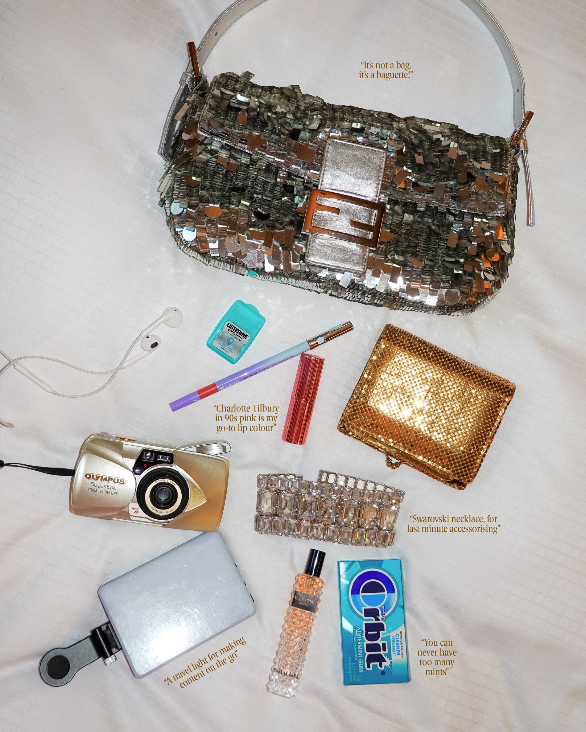 Caroline Vazzana's sequin silver bag during CPHFW 2026, filled with mints, perfume, travel ligth, swarovski necklace, digital camera, wallet and makeup.