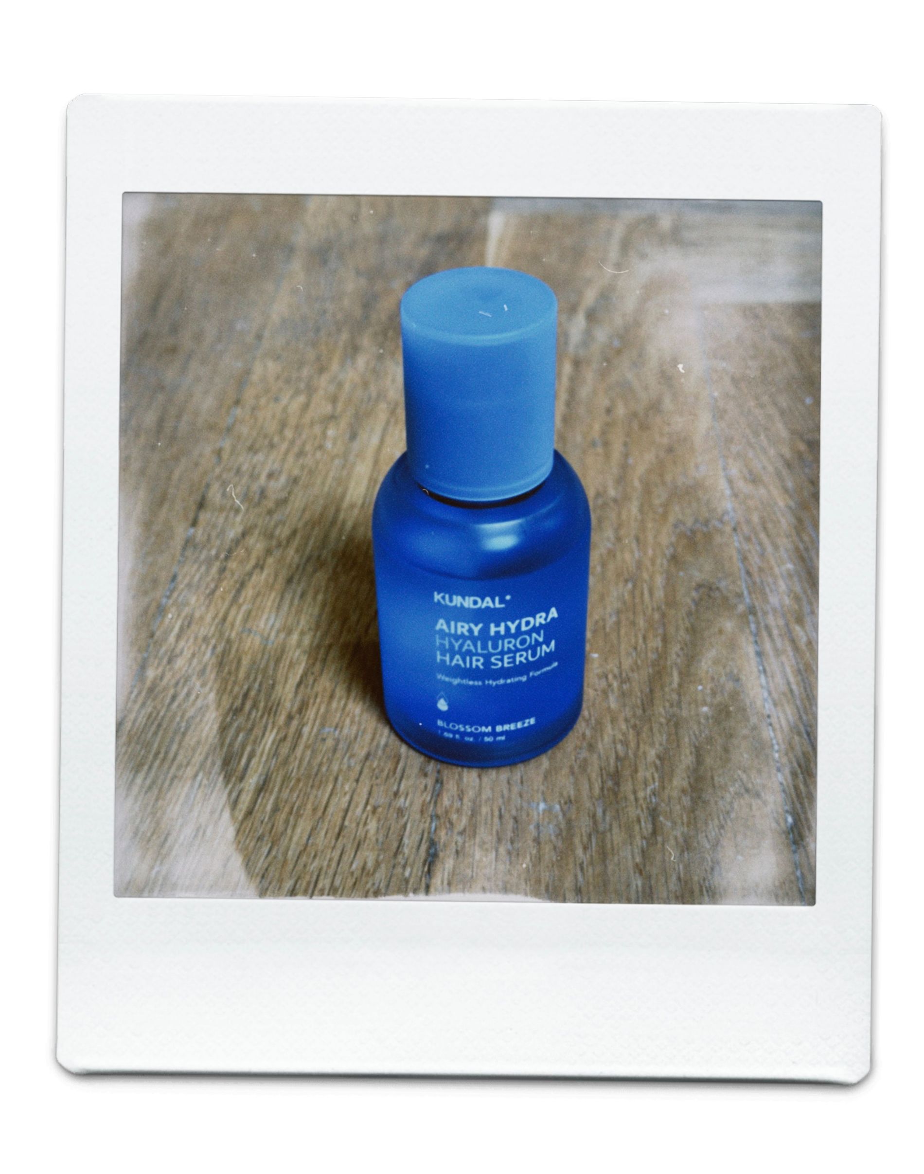 A blue small bottle with white text