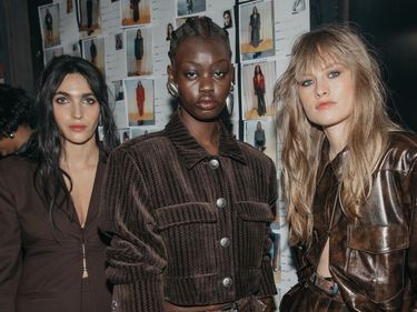 Models backstage at Gestuz sports the brand's rocker-chic dark eye and tousled hair