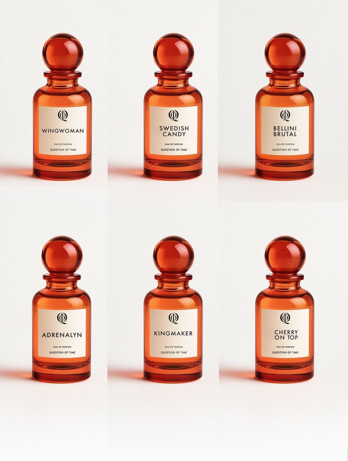 QOT's perfumes in a grid patterns, including Wingwoman, Swedish Candy, Bellini Brutal, Adrenalyn, King Maker, Cherry On Top,