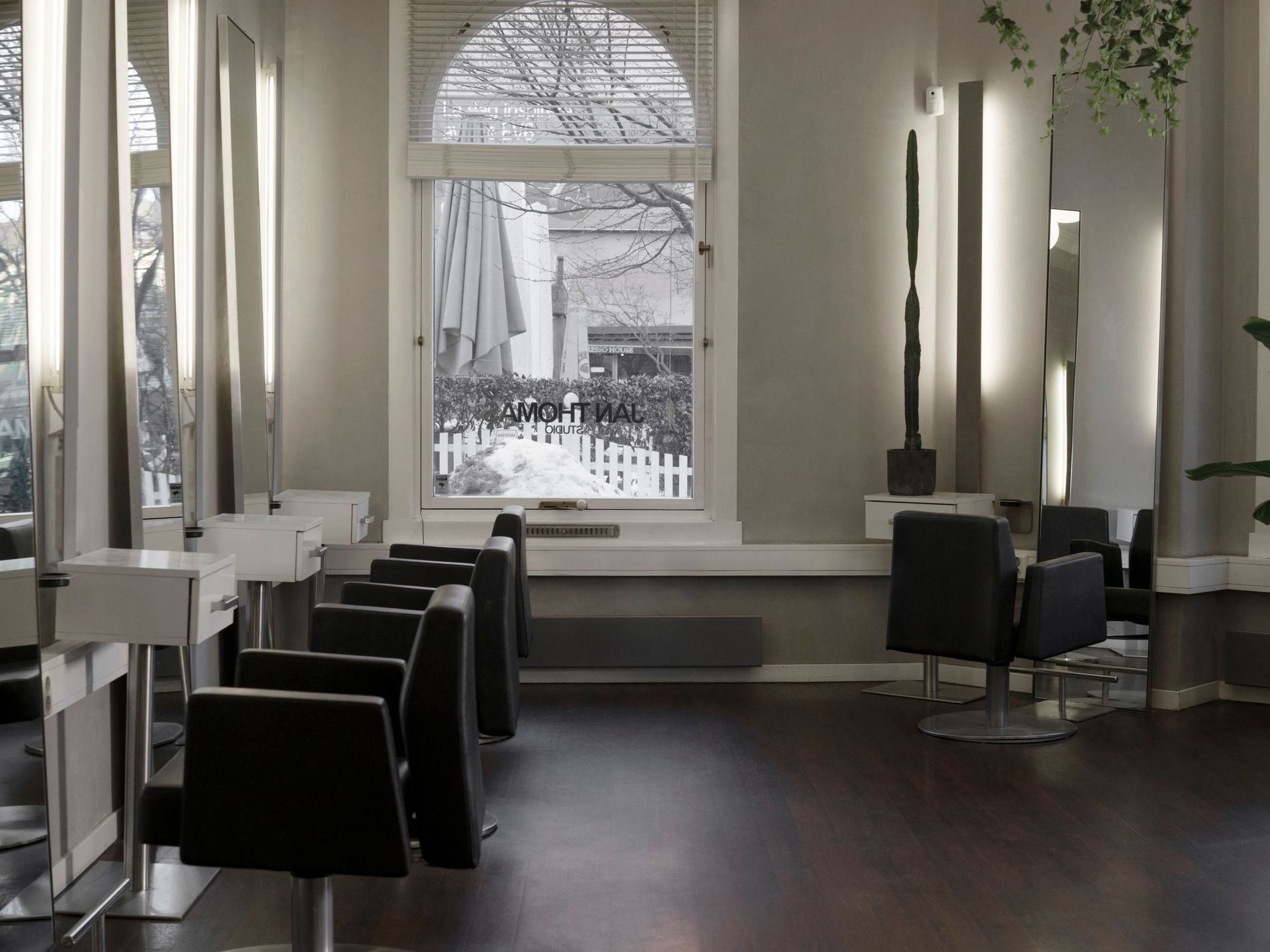 Jan Thomas Studio's hair salon is all airy windows, plants and suave interiors