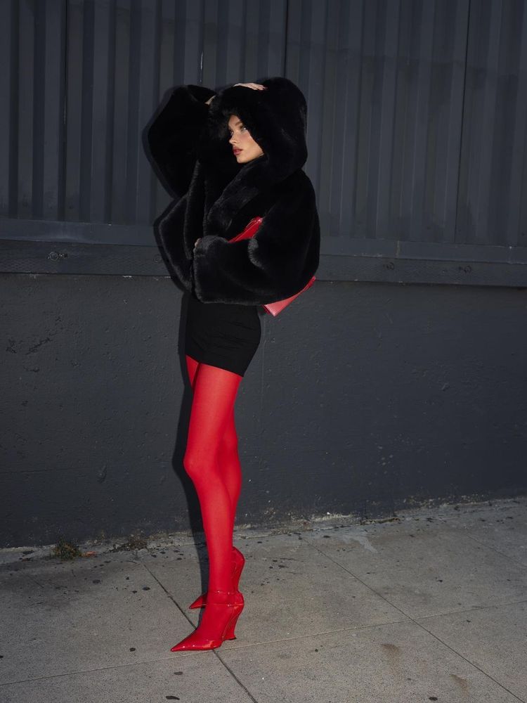 Over the knee, patterned tights are done in bubbly red mohair which