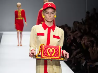 A model walks Moschinos McDonalds-inspired AW14 runway show 