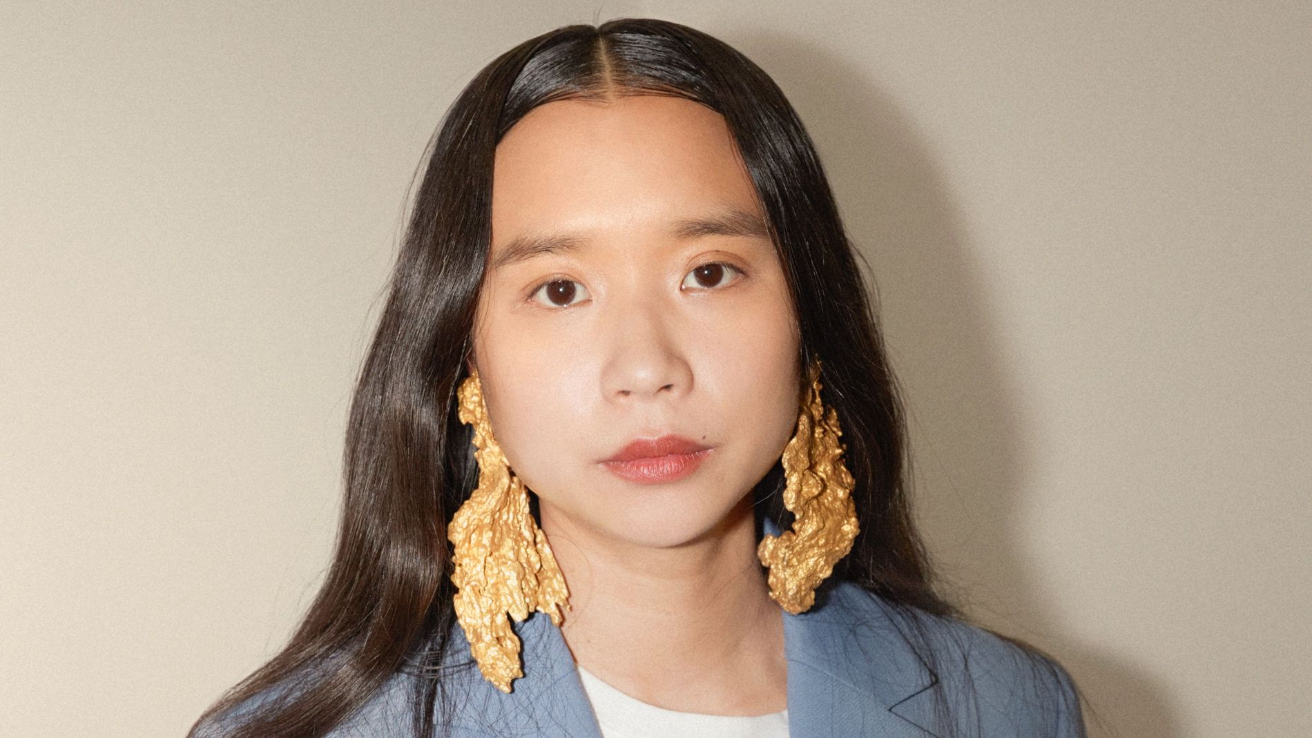 Lap-See Lam wearing Ingy earrings