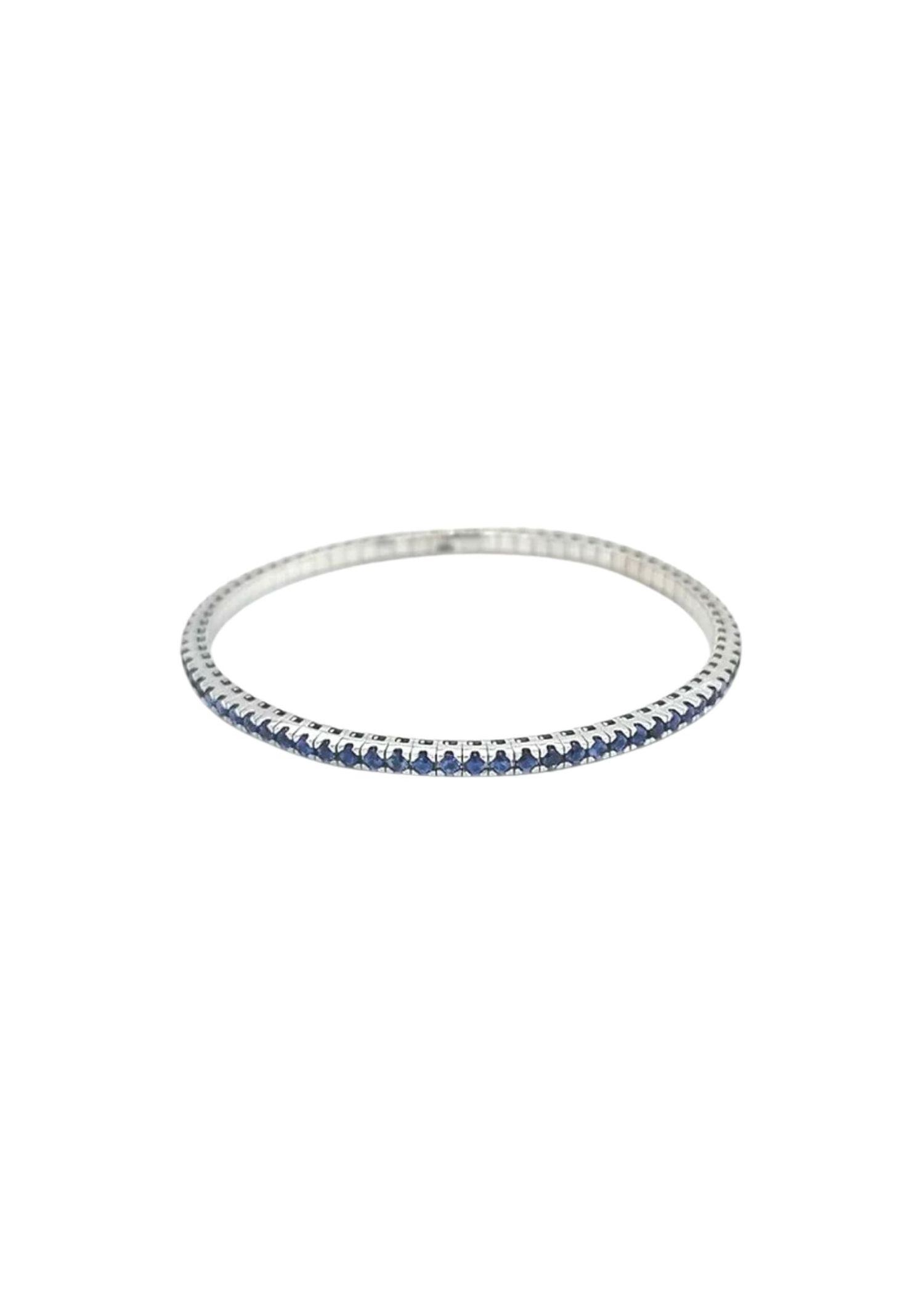 Elastic Tennis — blue sapphire on an elastic tennis band in 18k gold.