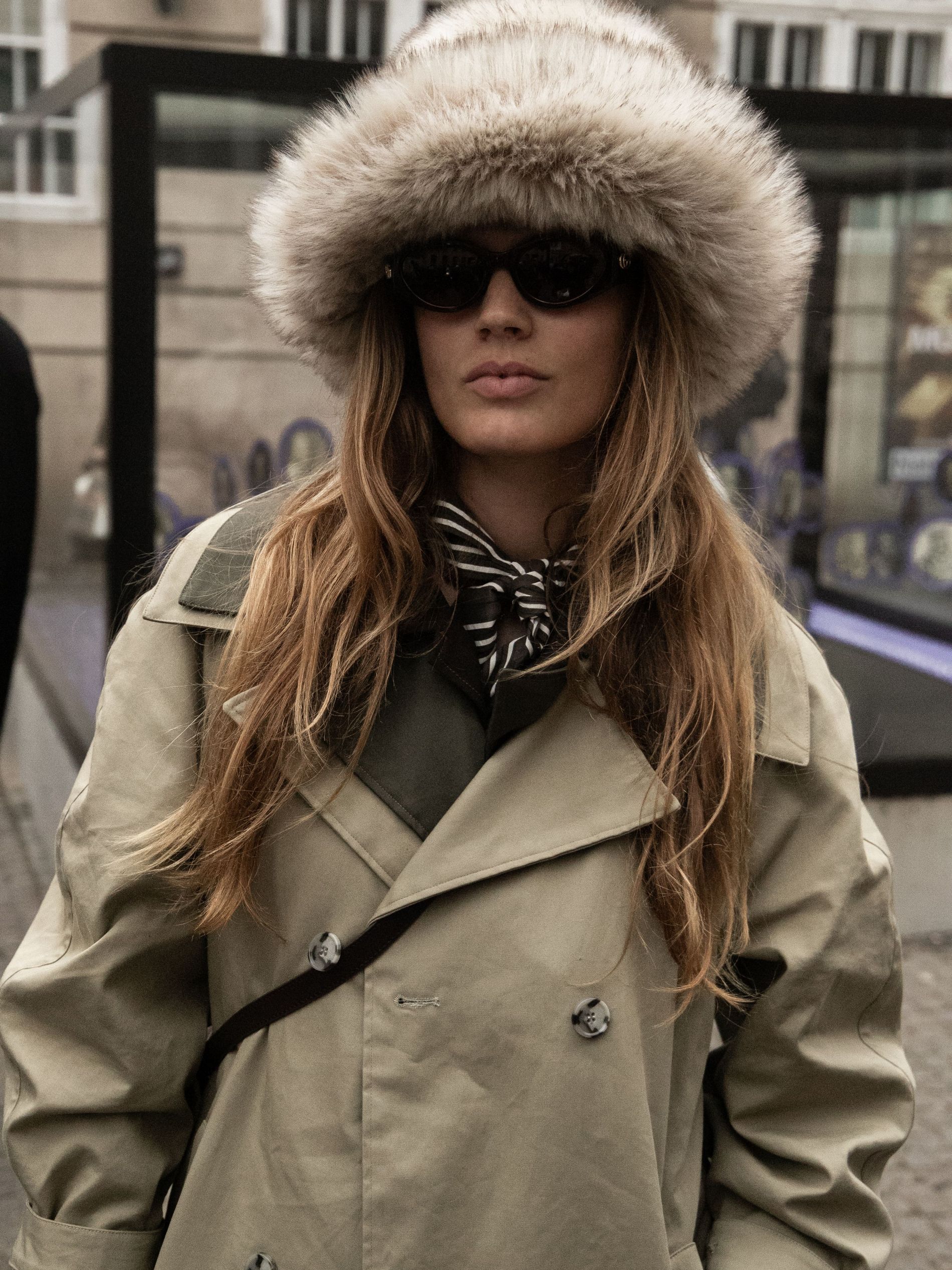 A guest wears a faux fur hat at Copenhagen Fashion Week