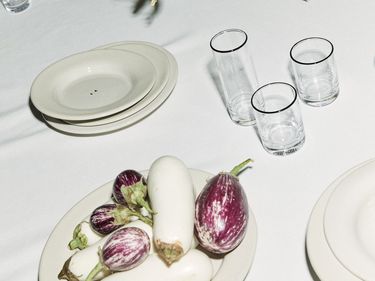 Table scape of Sophia Roe's interior collaboration, highlighting plates and glassware