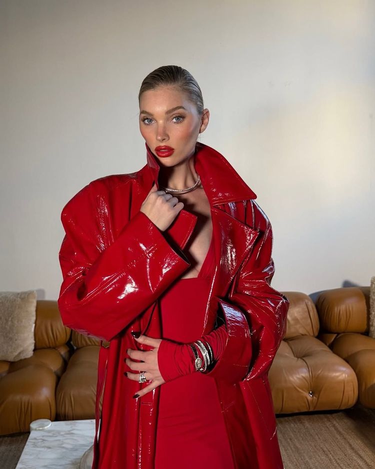 Elsa Hosk wears an all-red outfit, slicked back hair and red lipstick