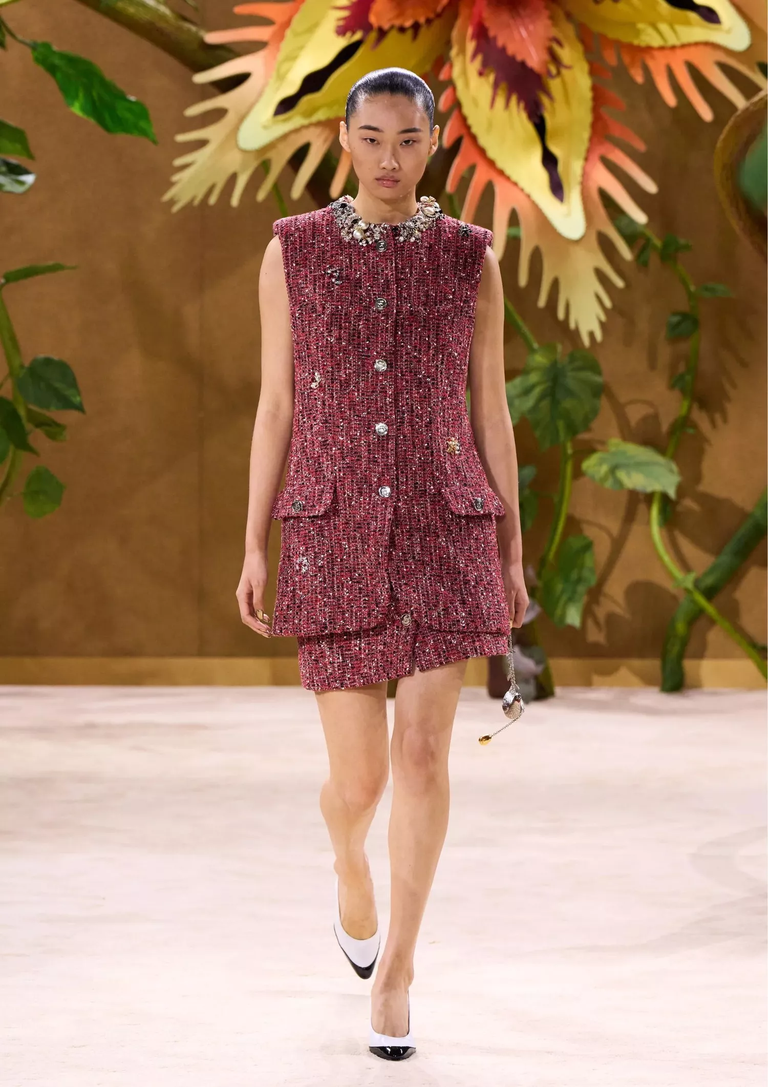 Red sleeveless tweed vest, a matching mini skirt