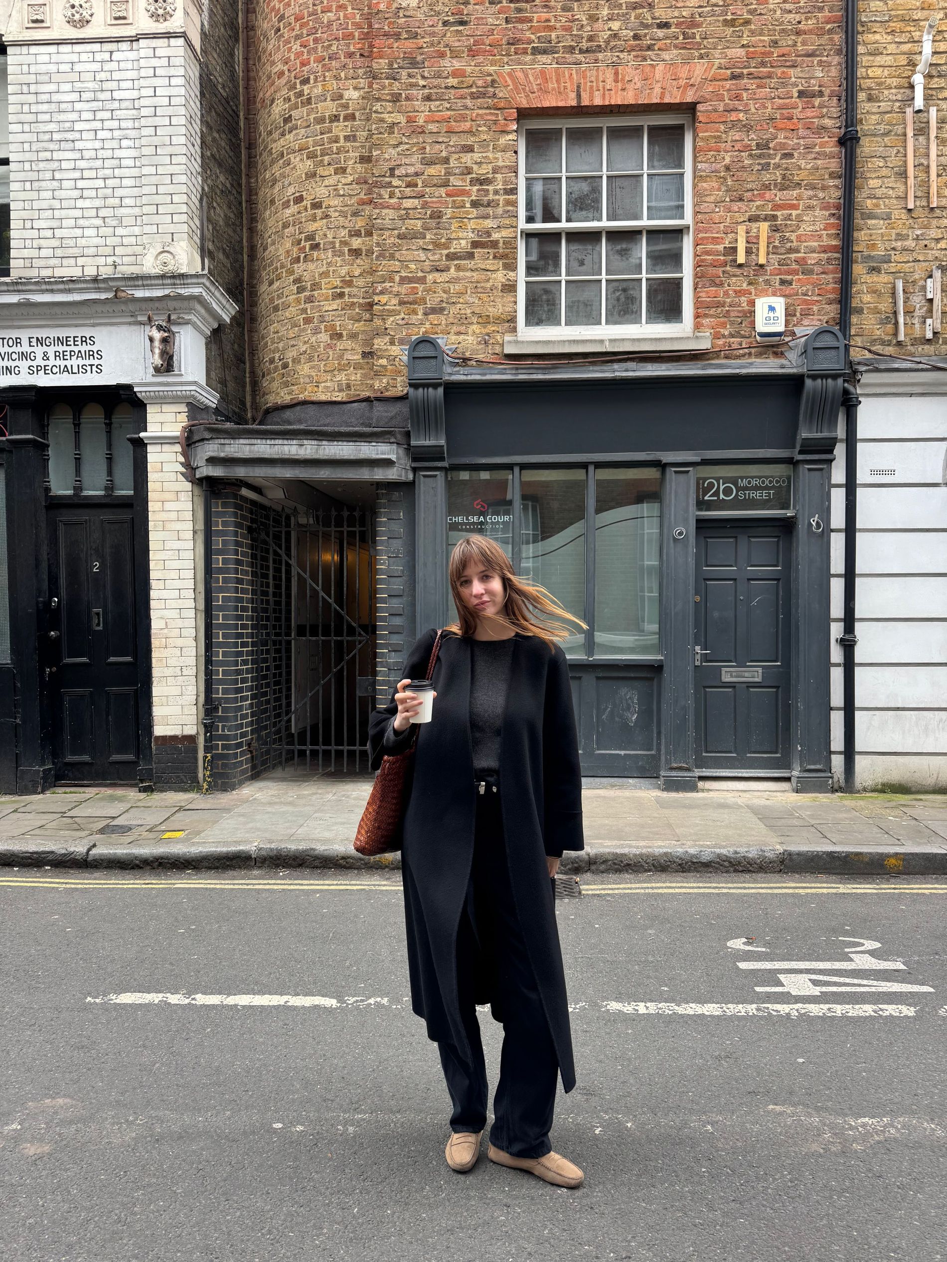 A woman standing on the streets of London