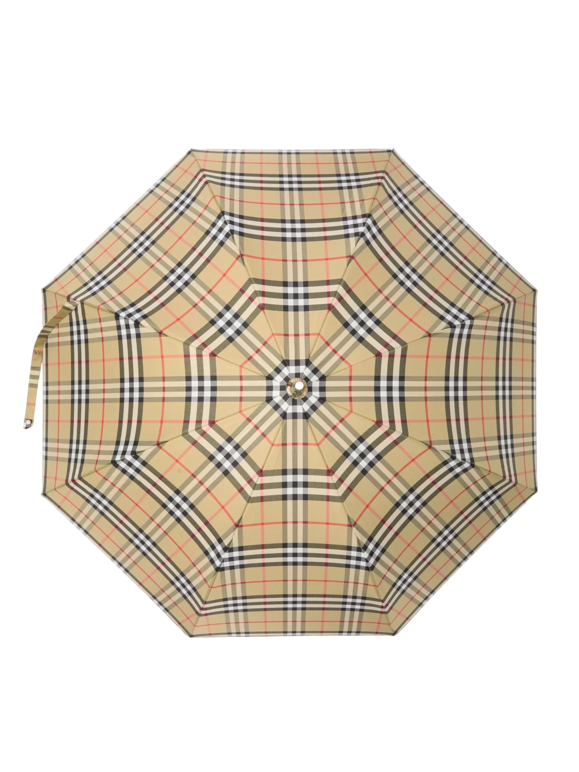 Beige check umbrella against a white background