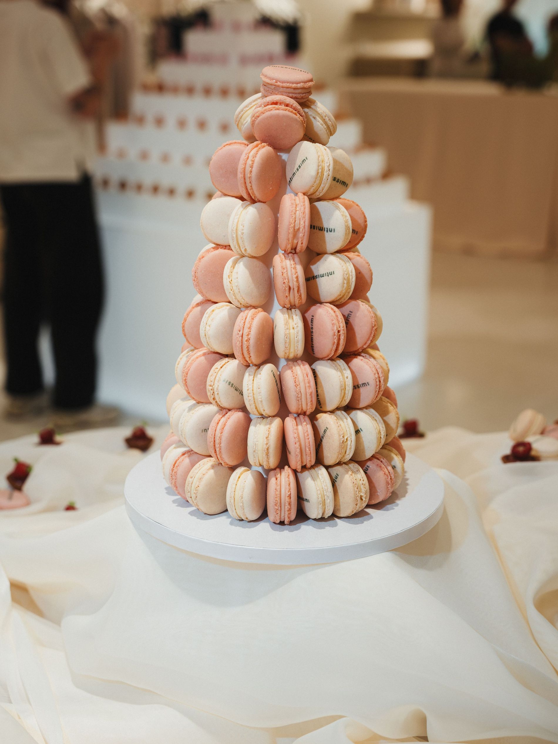 Macarons tower in llight pink and white on a Intimissimi event