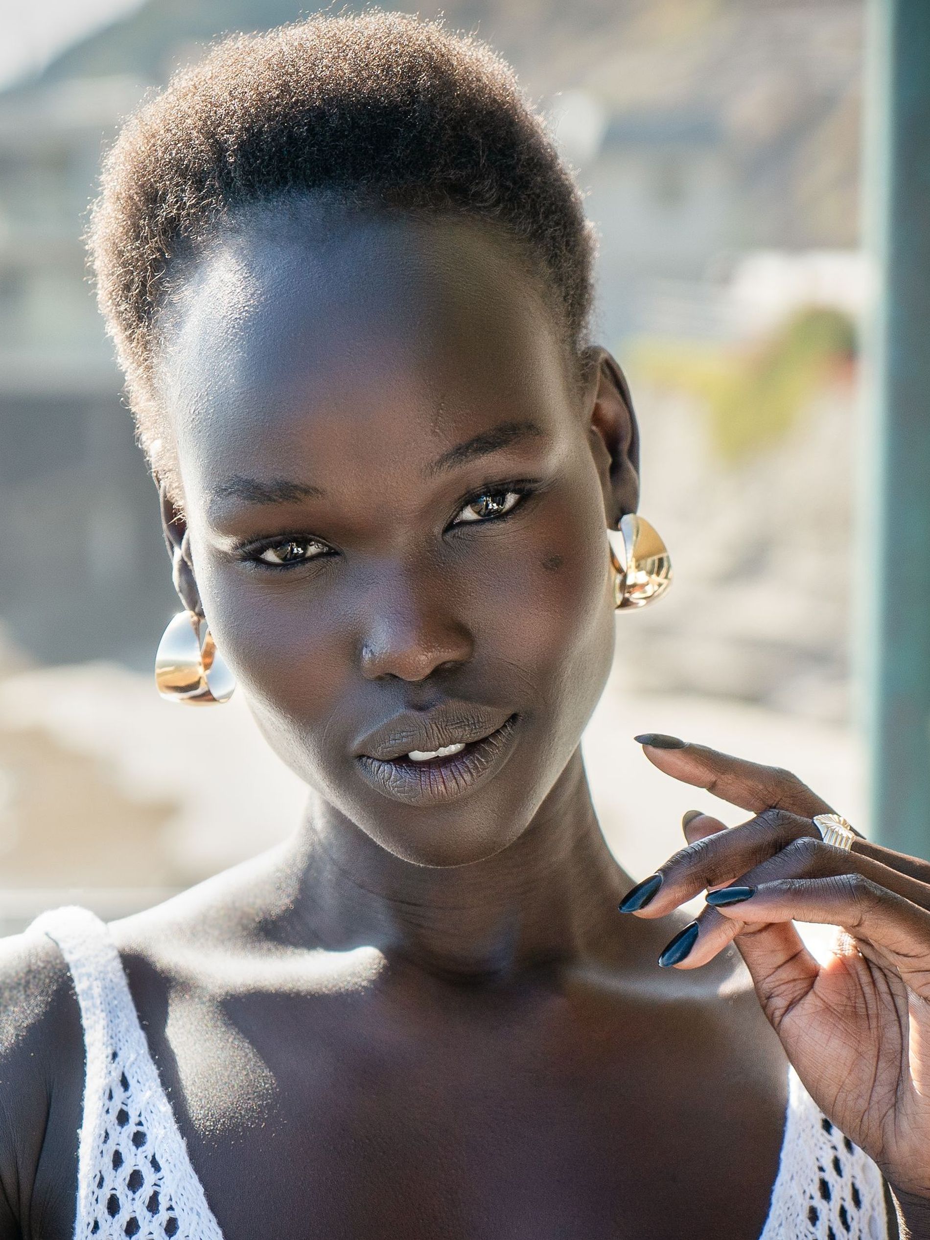 Woman facing the camera outside