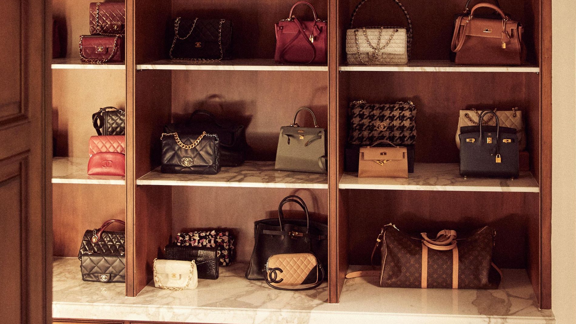 Closet organisation system full with designer bags 