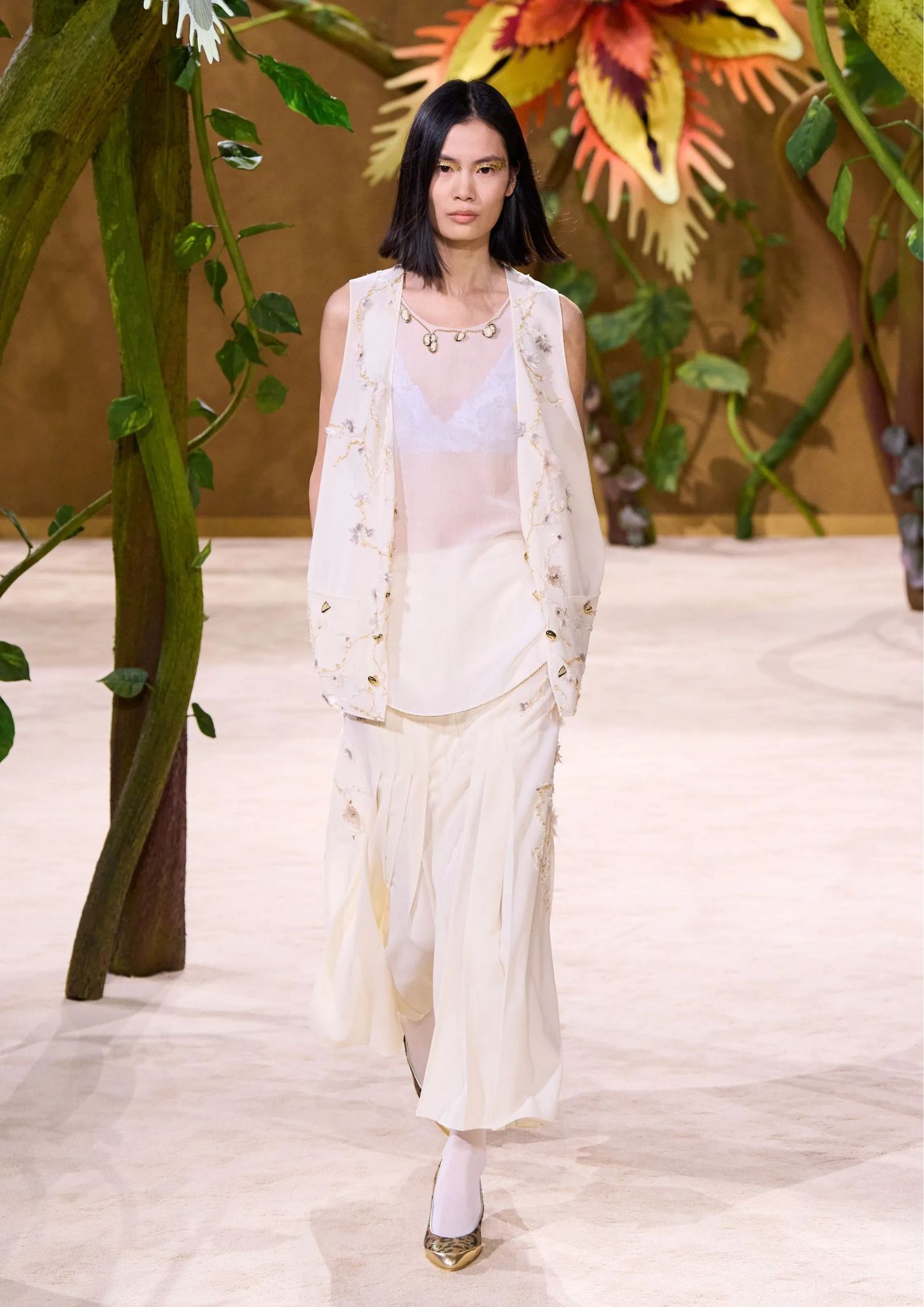 Sheer sleeveless top, embellished cardigan, a maxi skirt, and pointed-toe boots