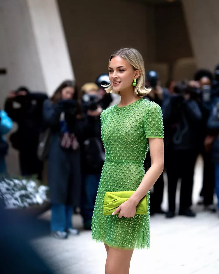 Emilia Silberg attending NYFW25 in a green dress