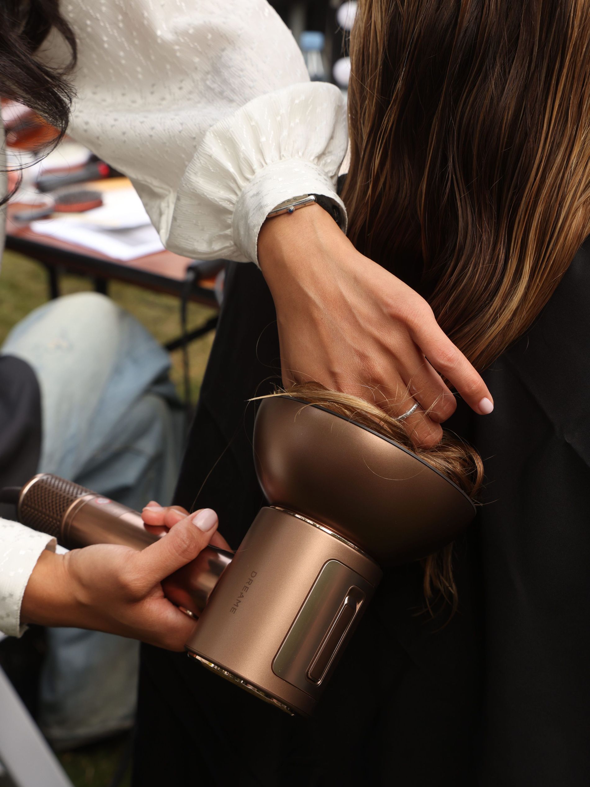 Model getting her hair done at OperaSport backstage