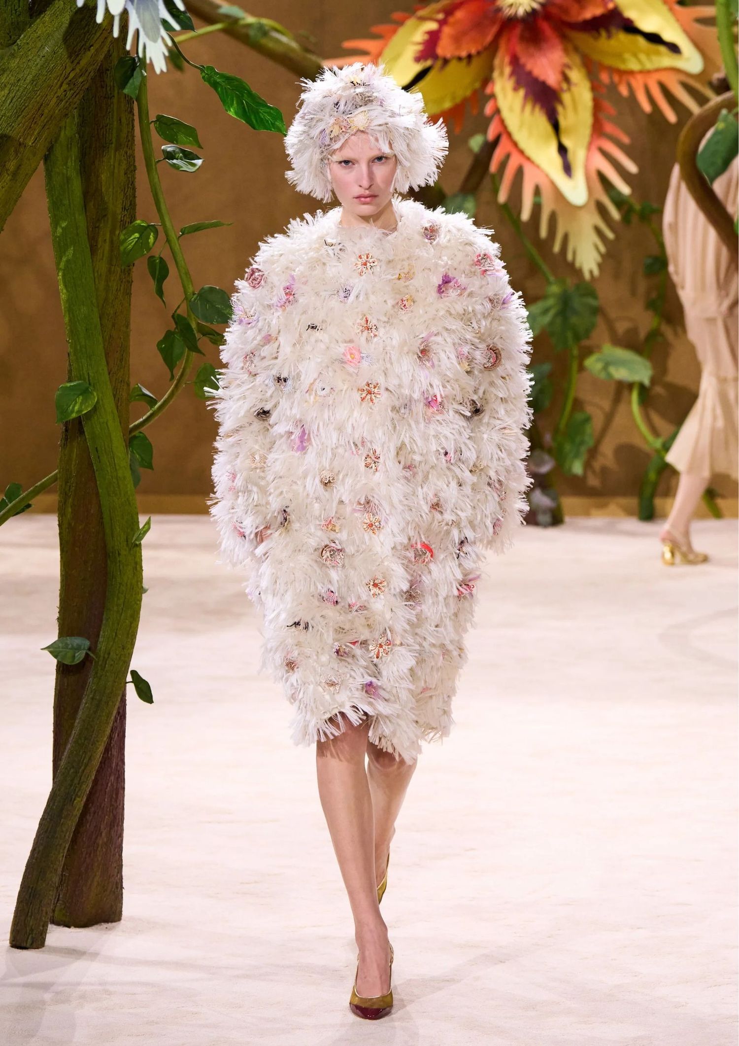 Feather-textured cocoon coat, with a matching feathered hat