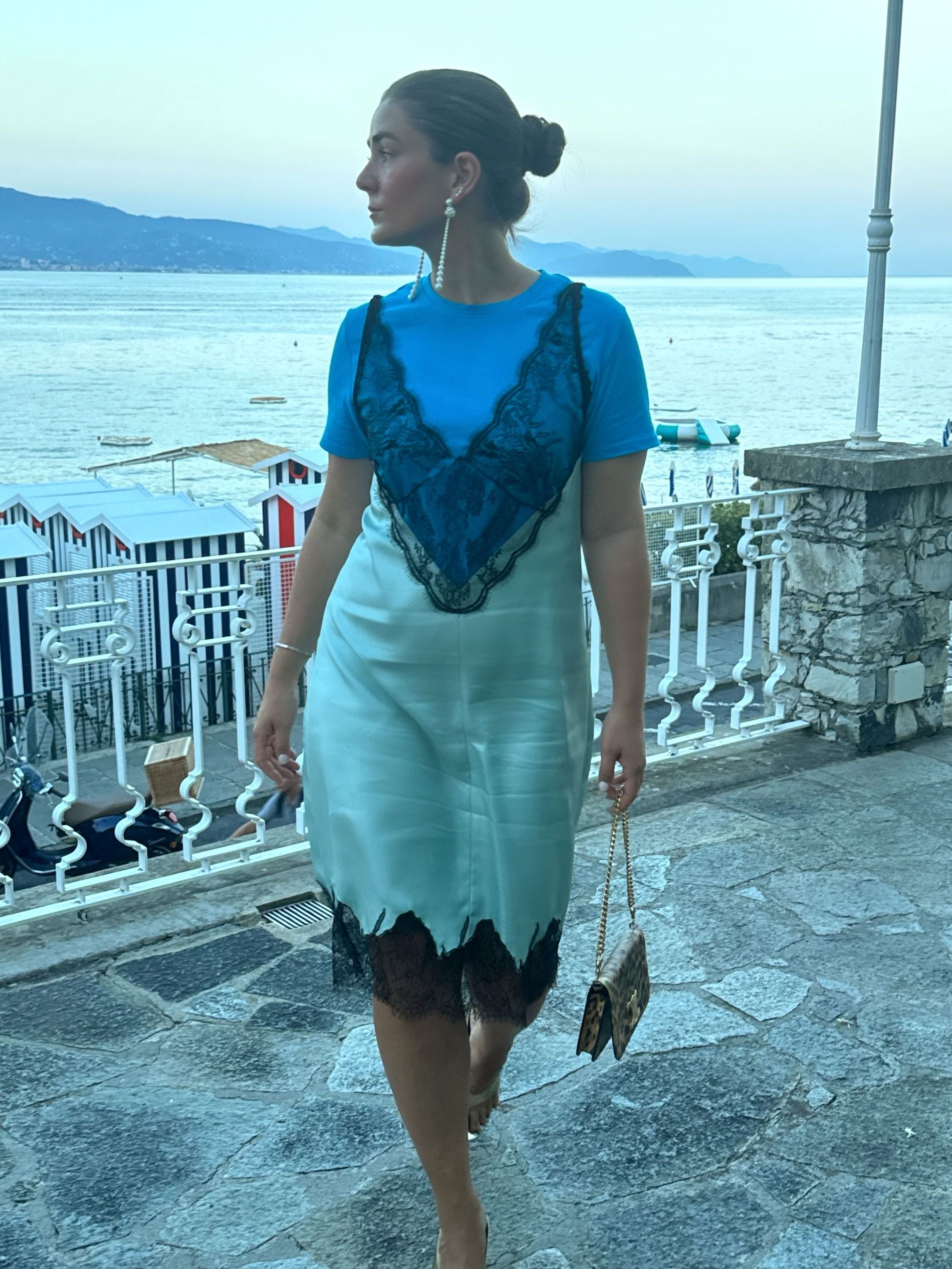 Linn Eklund wears a blue shirts and celine silk and lace slip dress