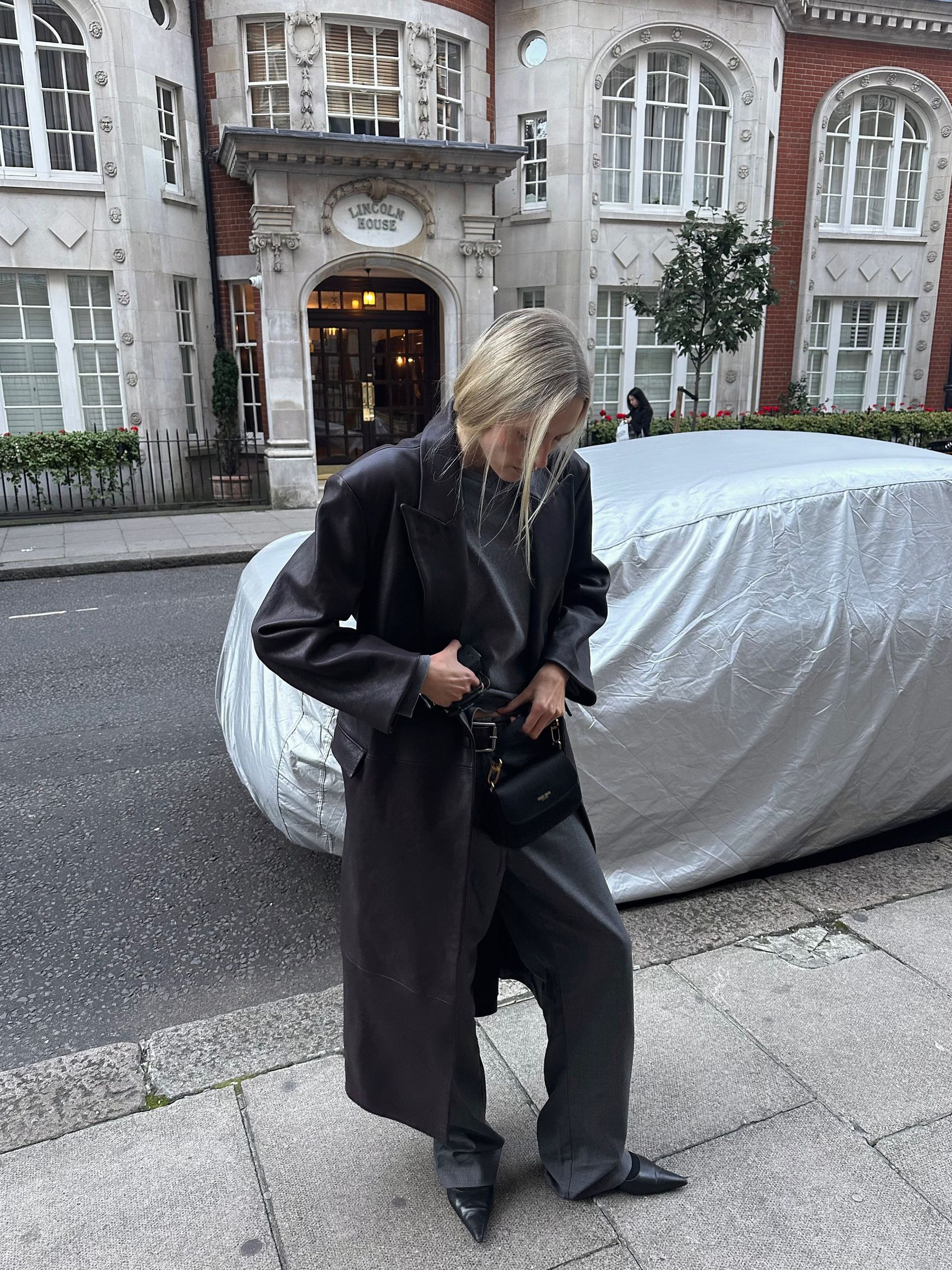 Model Maddie Demaine standing on the streets of London