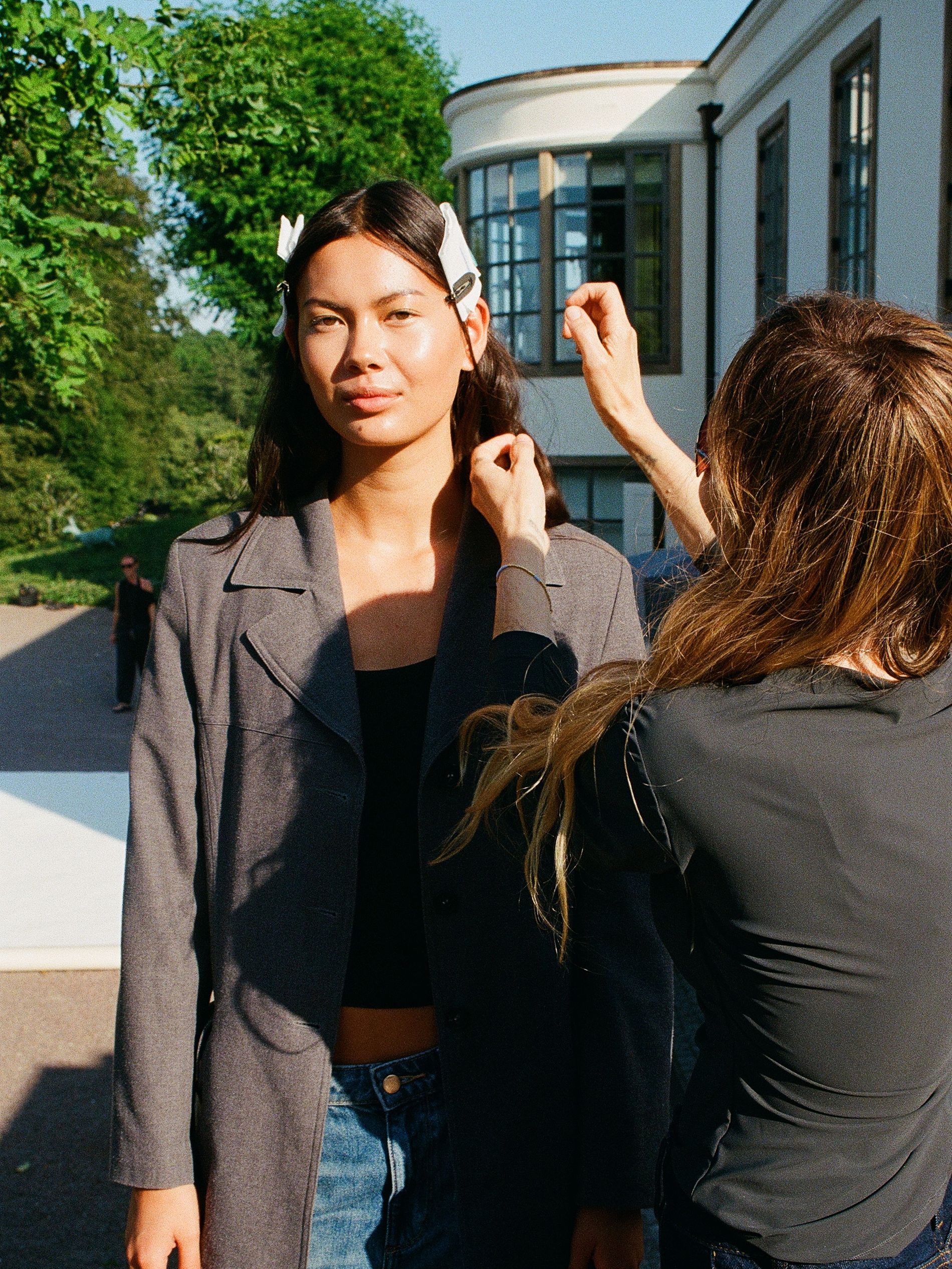 Model getting her skin prepped at the By Malene Birger SS27 show