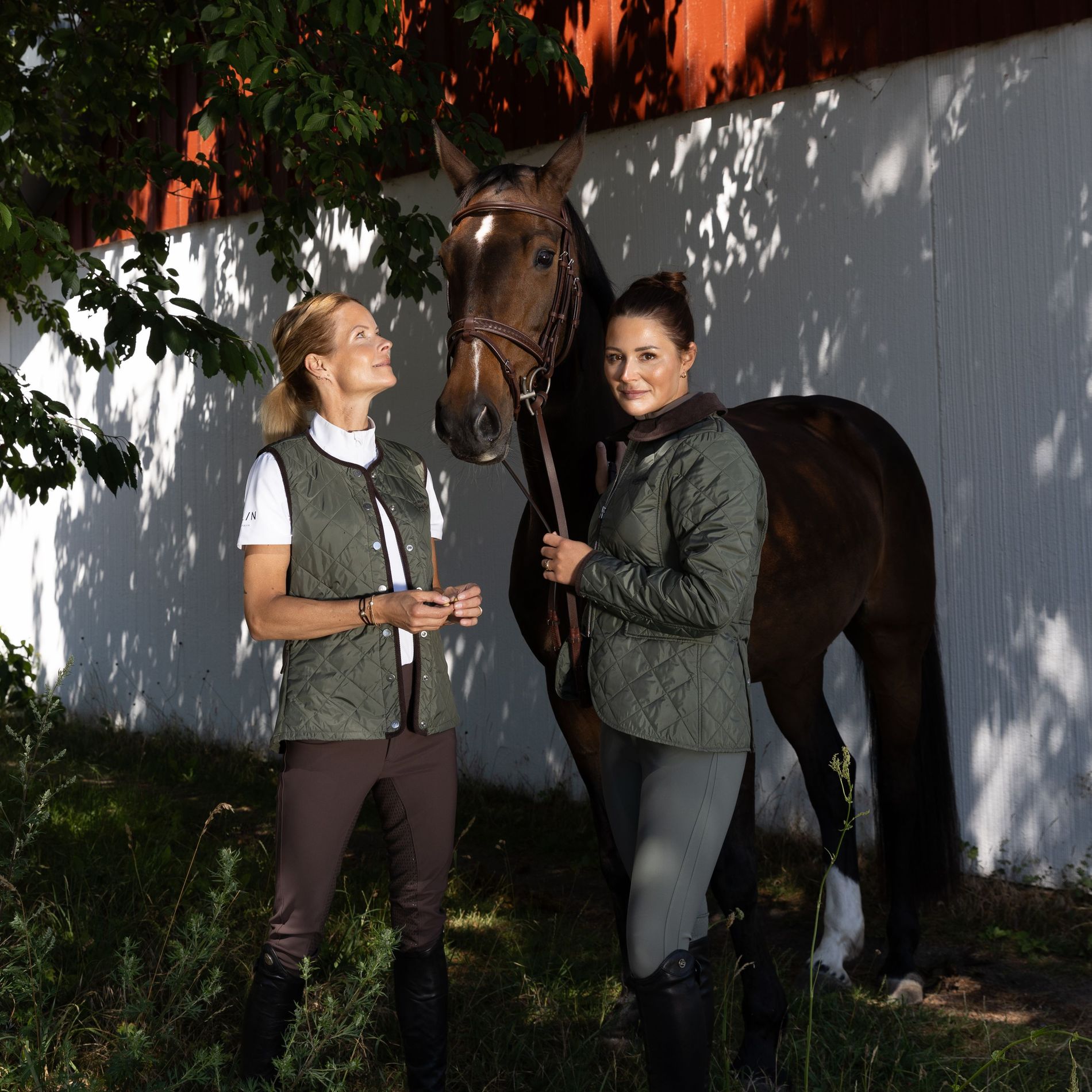 Malin Bayard & Nicole Holmen pose with a horse at Flasterbo horse show wearing All In Equestrian