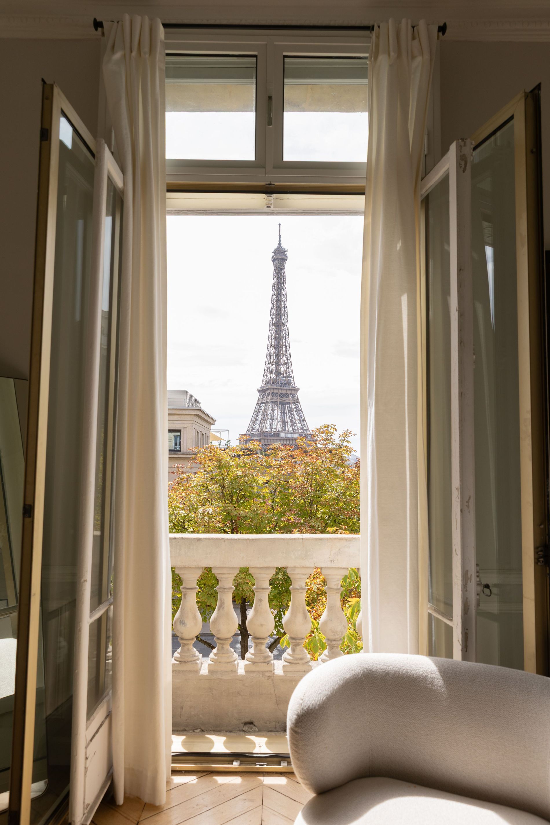 The Eiffel Tower seen through the window of the hotel suite.