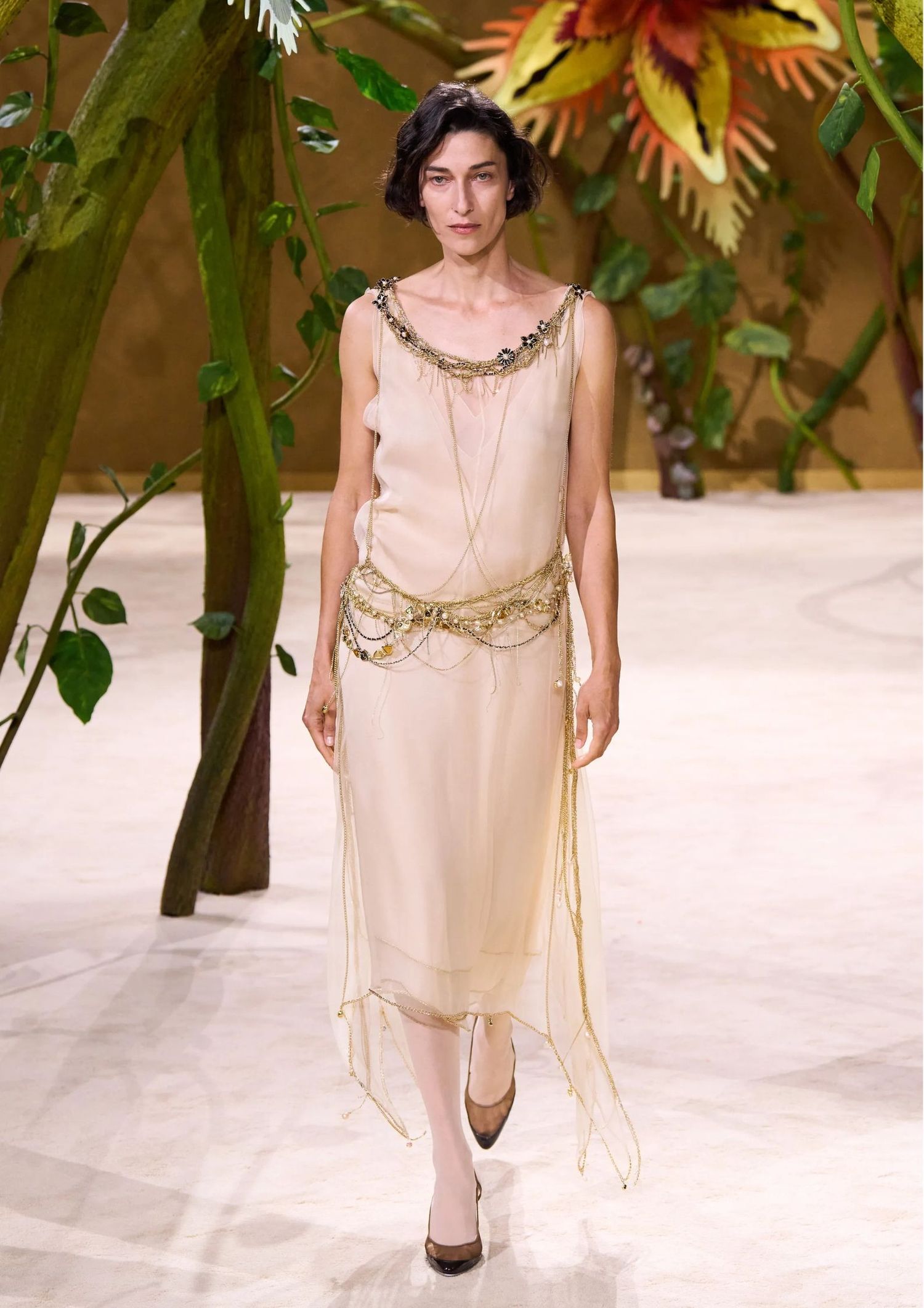 Long sheer dress with gold jewellery