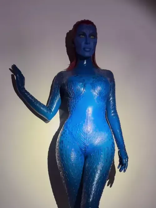 Kim Kardashian, who morphed into Mystique from X-Men, with the help of Vex Latex and a lot of blue face paint. 