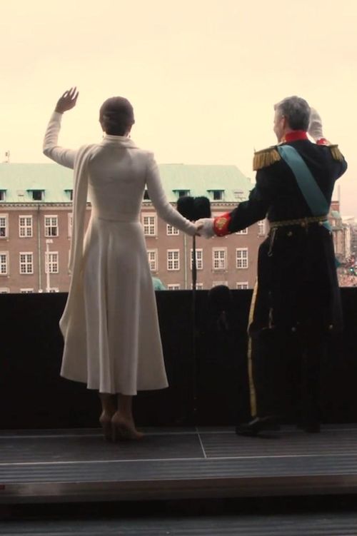 Queen Mary and King Frederik wave from the balcony