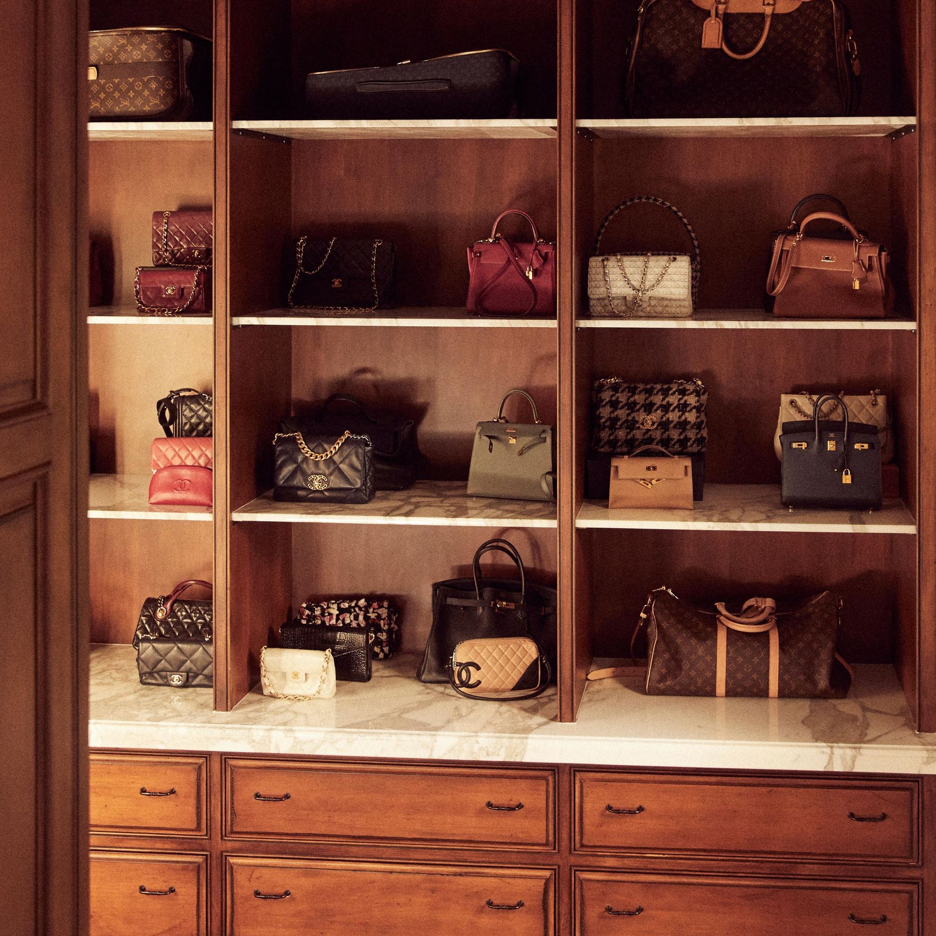 Closet organisation system full with designer bags 