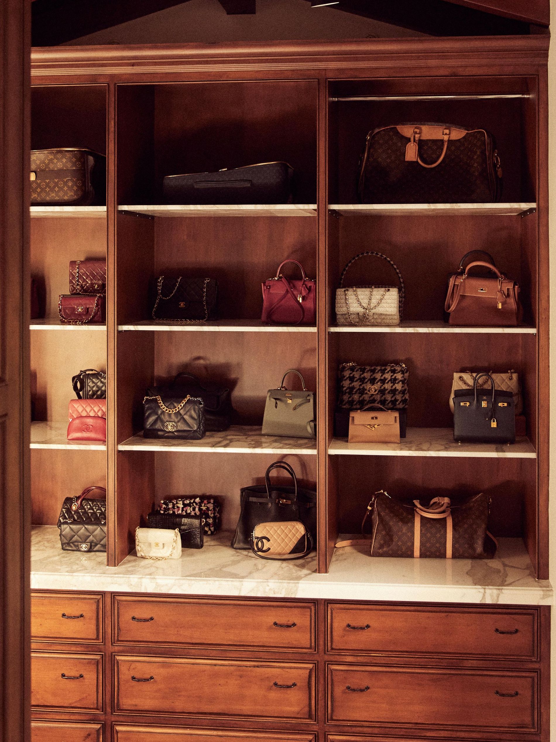 Closet organisation system full with designer bags 