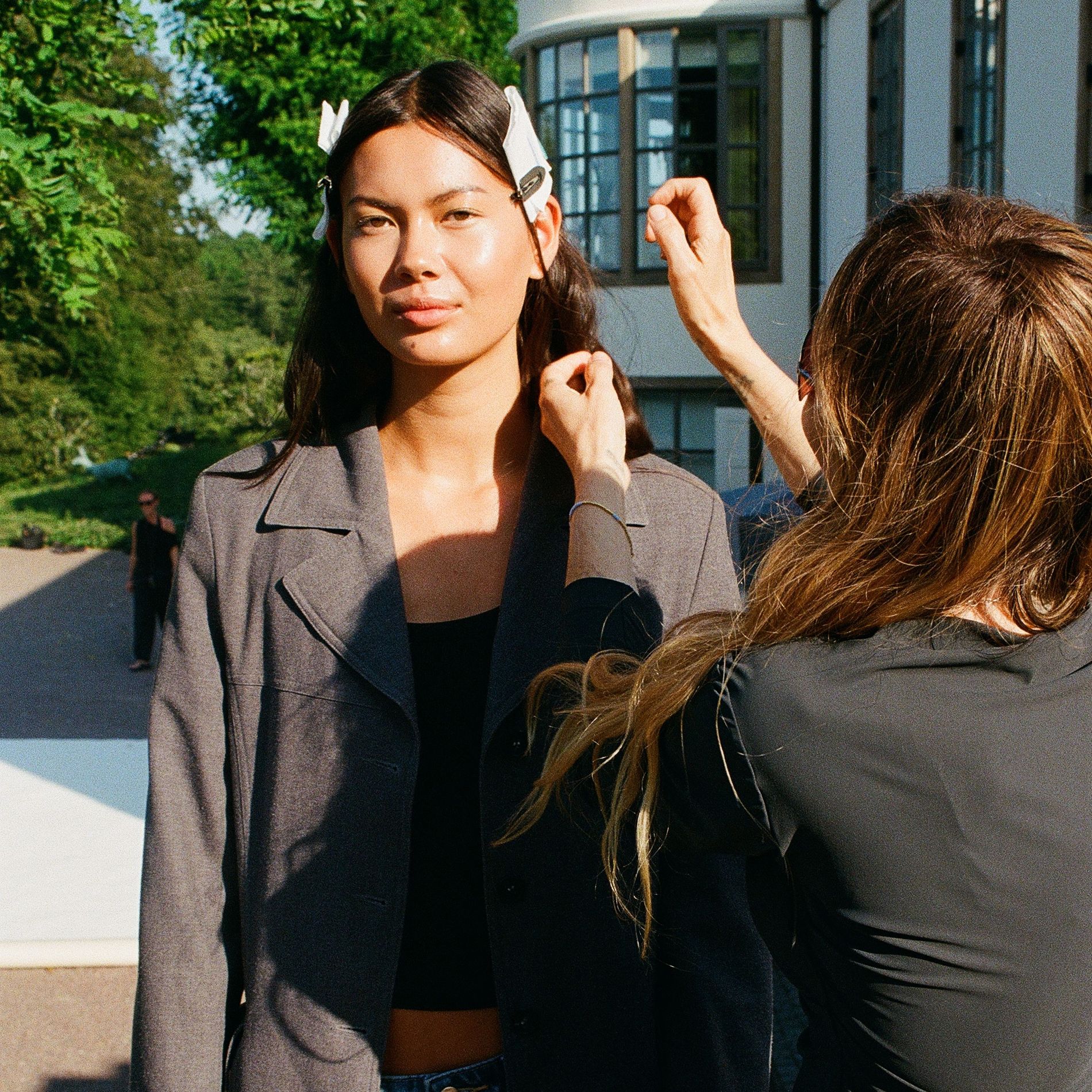Model getting her skin prepped at the By Malene Birger SS27 show