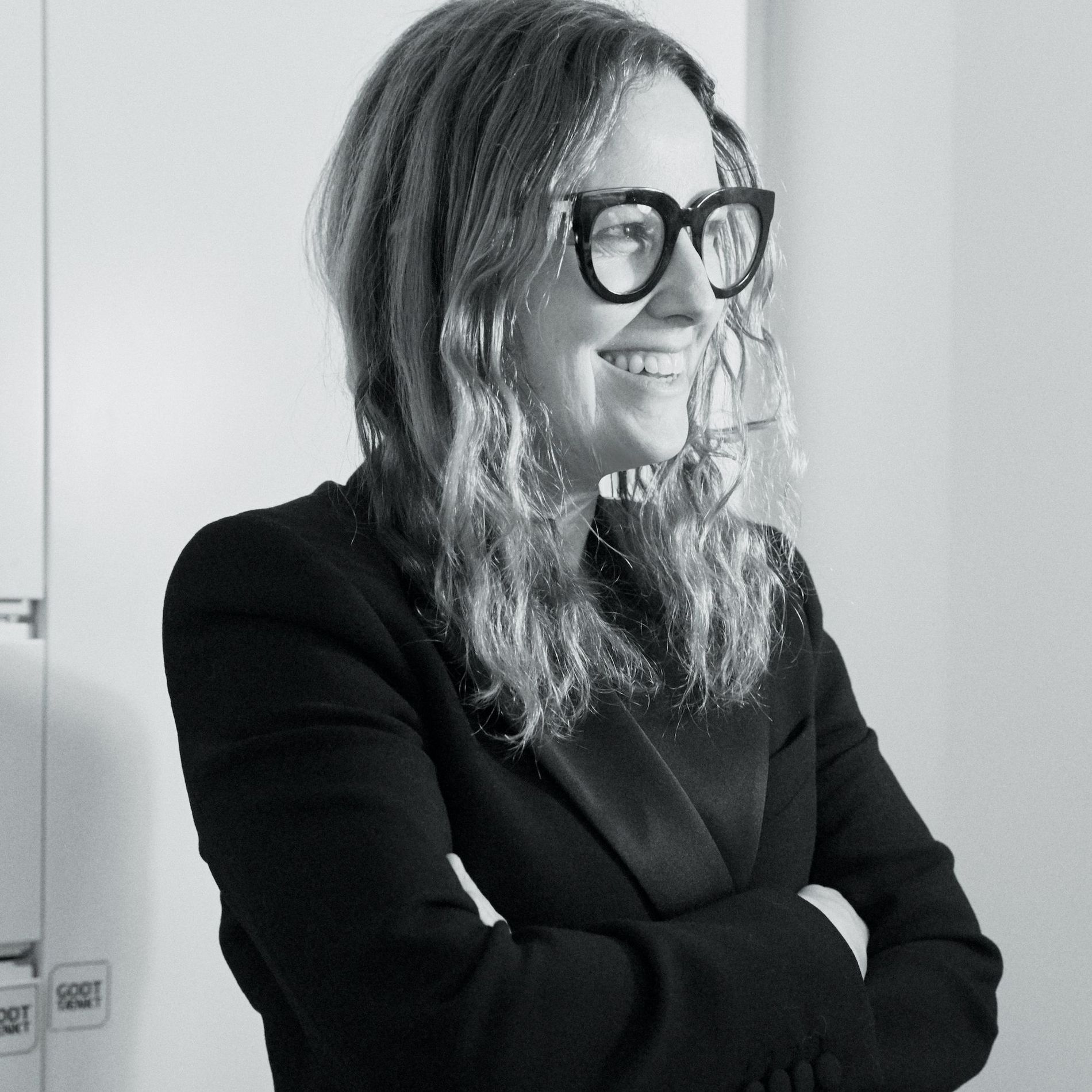 Designer Carin Rodebjer with her arms folded in a black and white portrait