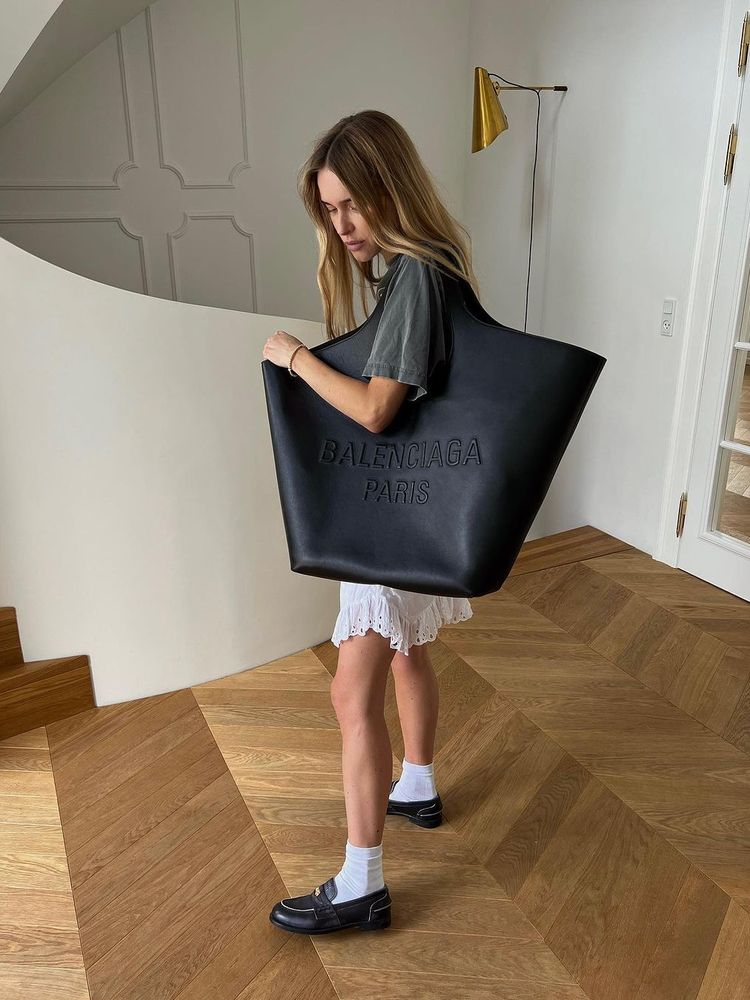 Pernille Teisbaek carries an XXL Balenciaga bag on her shoulder