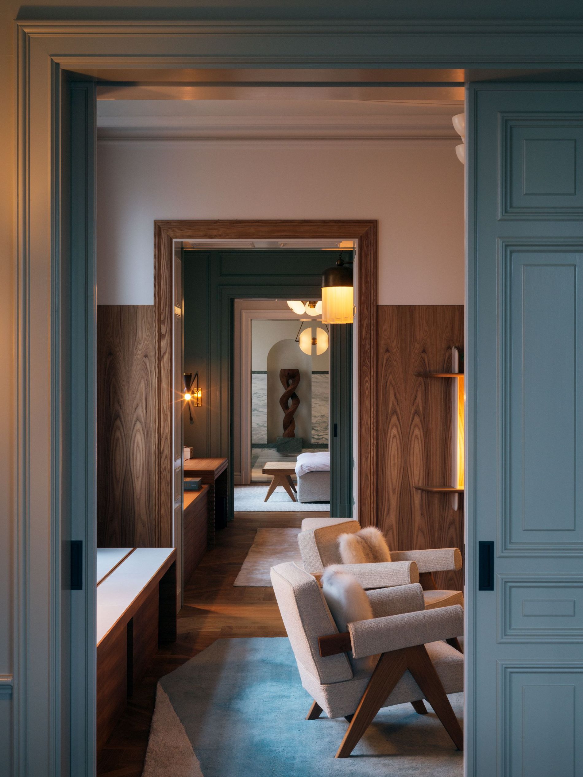 A spacious apartment rendered in white, blue and wood