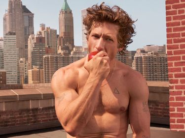 Jeremy Allen White eating an apple in the latest Calvin Klein Ad