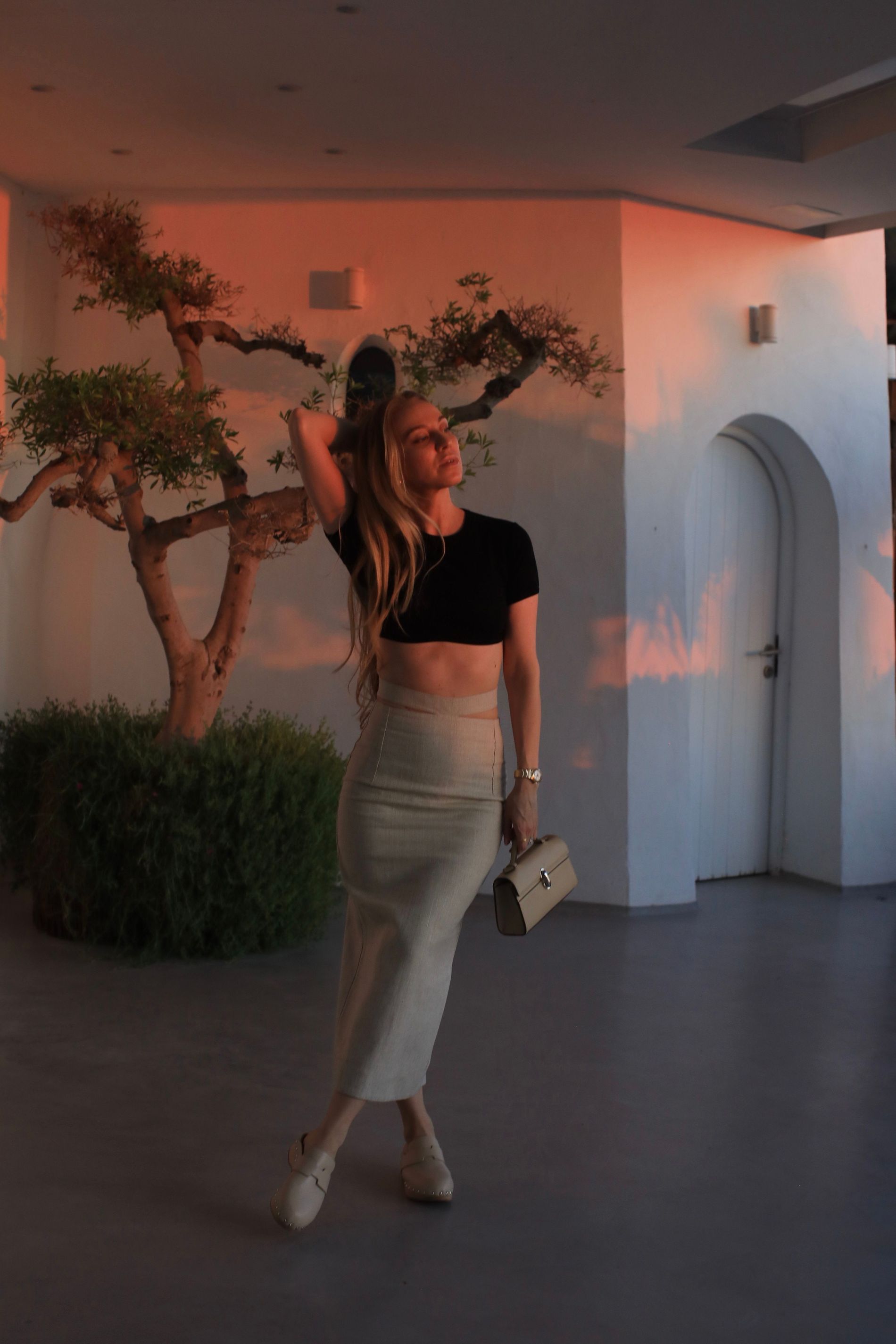 Sandra Hagelstam pairs a pencil skirt with Hermès clogs