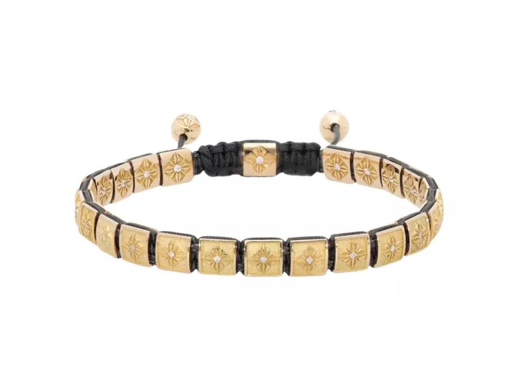 This is a luxury Shamballa Jewels Lock Bracelet featuring square 18k yellow gold beads accented with brilliant-cut diamonds along a black braided macrame, on a white backgroundcord