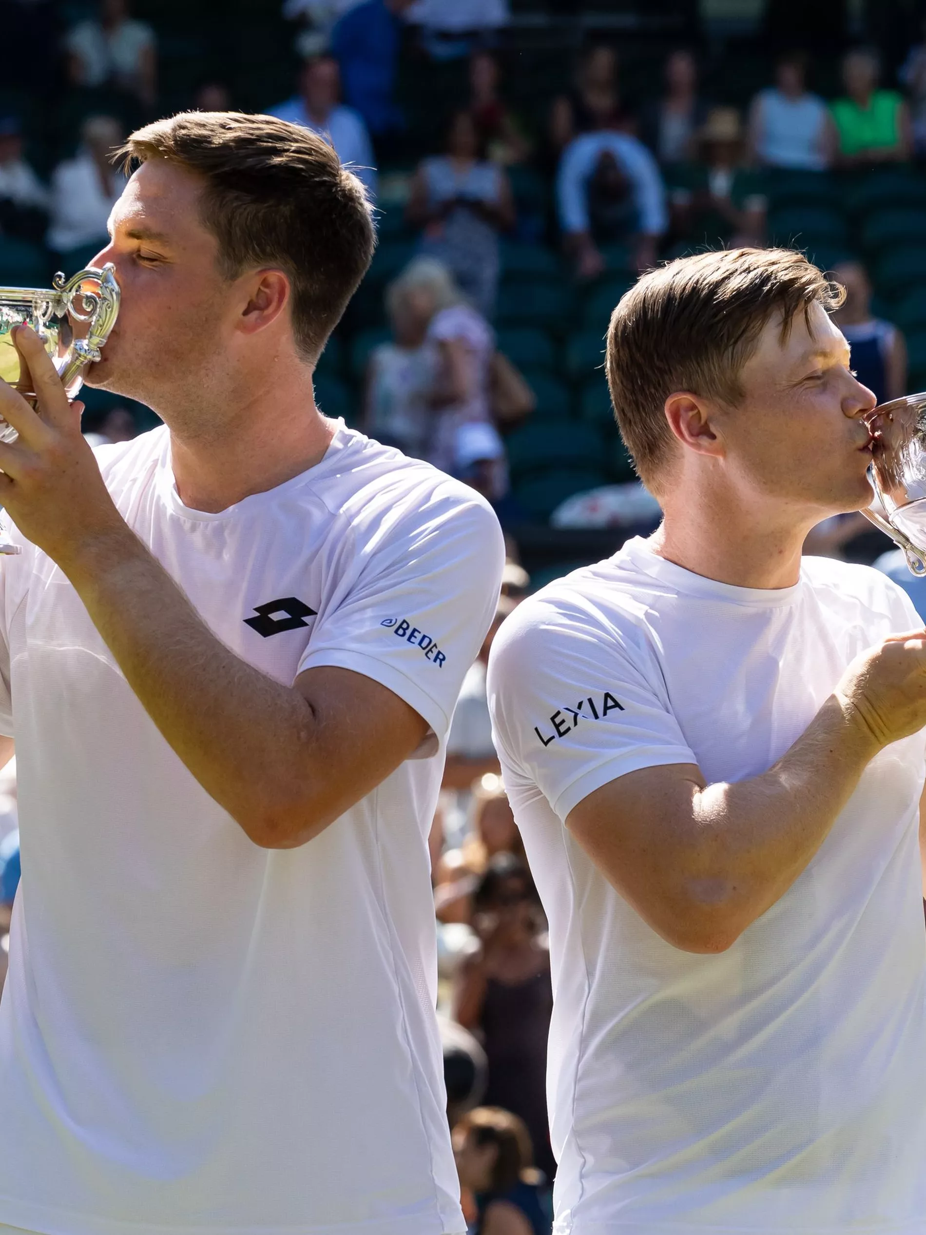 Harri Heliovaara of Finland and Henry Patten of United Kingdom pose with their Gentlemen's Doubles final trophy after their victory at Wimbledon 2026