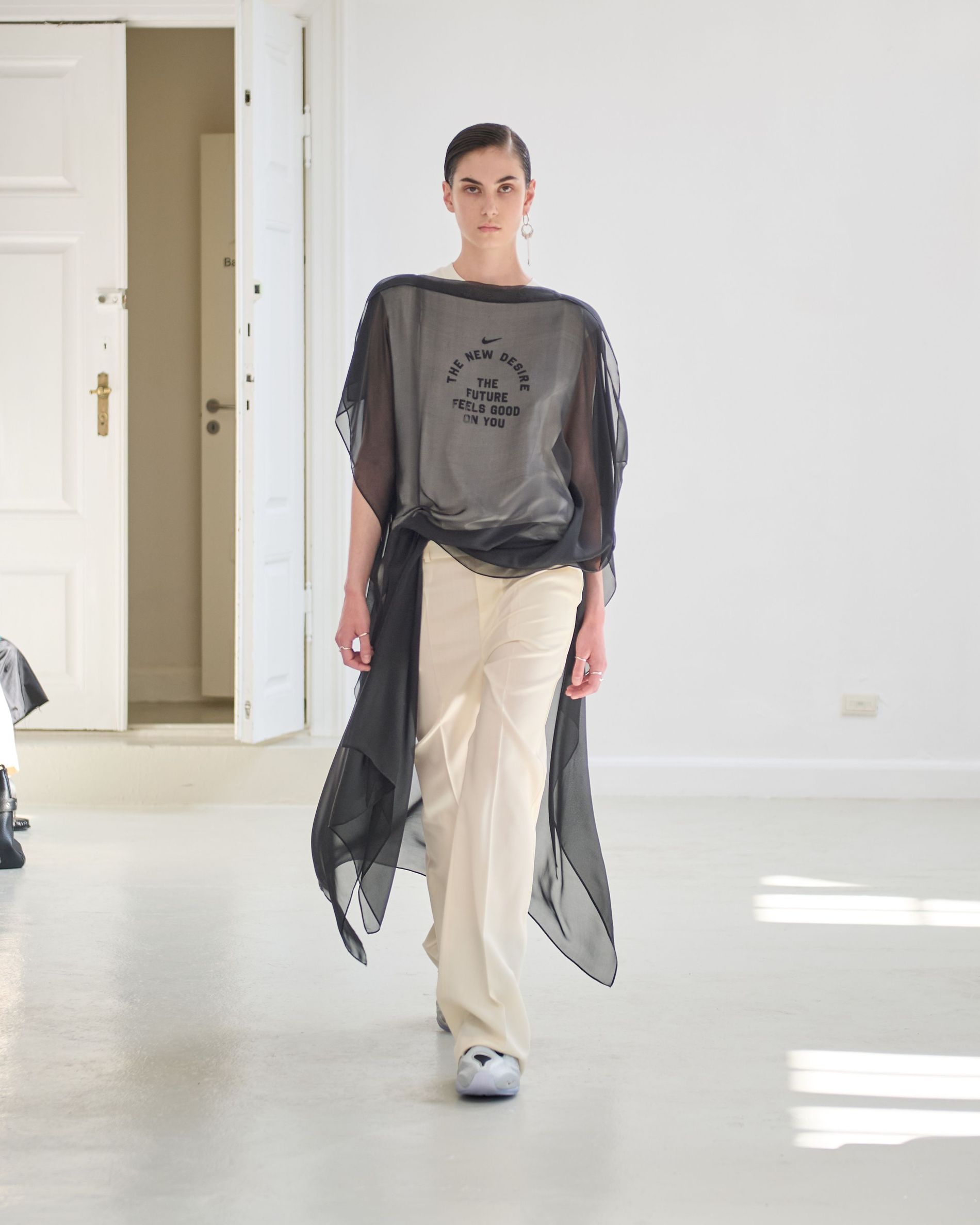 Black transparent top layered over a t-skirt